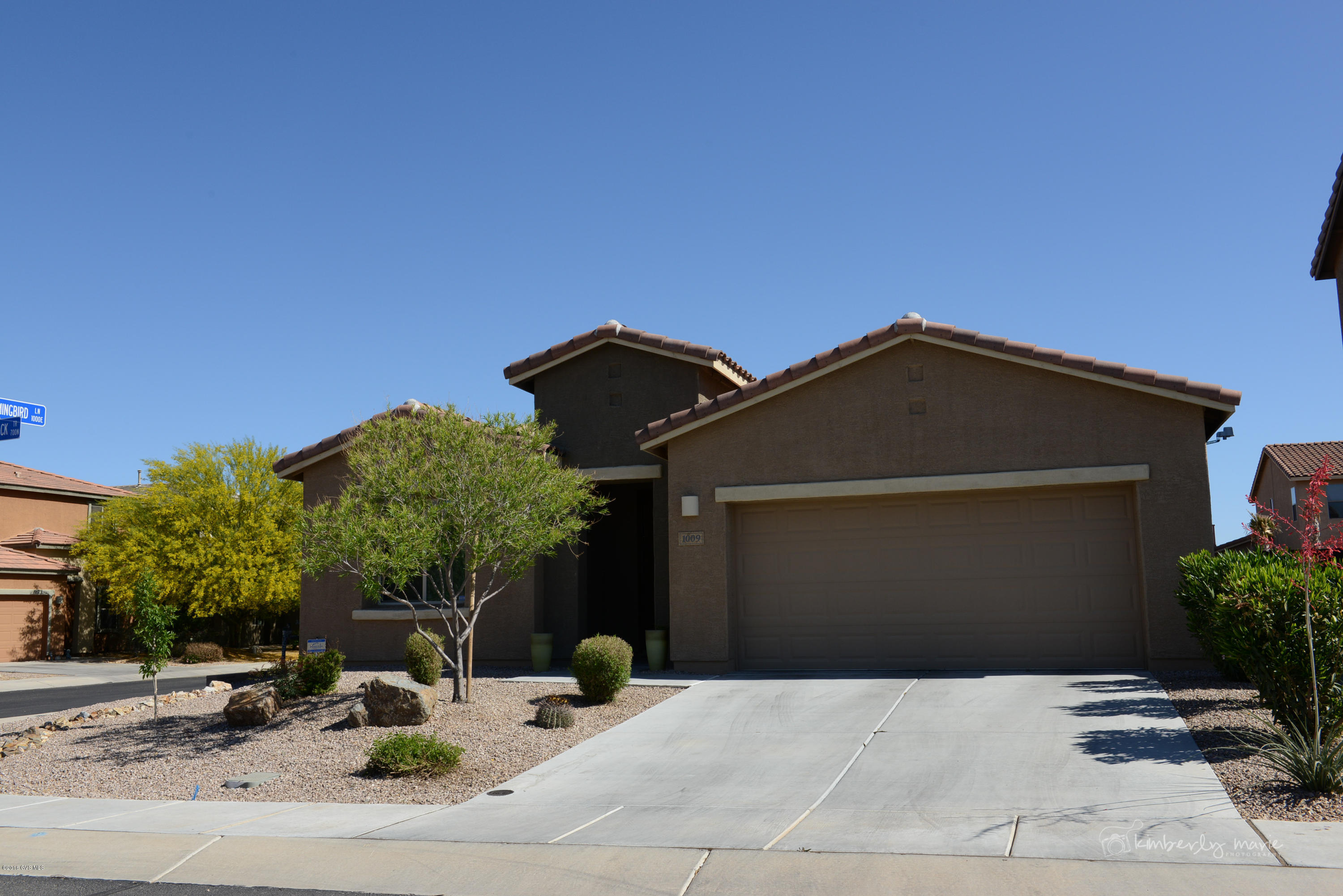 Highly upgraded corner lot that is only a couple years old and in excellent condition. This 3 bedroom home is ready for you to move right in. The upgraded kitchen boasts granite counter tops, stainless appliances, crown molding, beautiful cabinets, pull handles, and a great breakfast bar. The diagonal tile flooring and carpet are all top of the line, and the entire house is set up with a Rain Soft water filtration system and reverse osmosis. 4 ft Extended garage, full length extended rear patio, wood blinds throughout, surround sound pre-wired inside and on patio, cable in every room, and an alarm system. You can't build this house again for even close to this price. Call today for your showing!