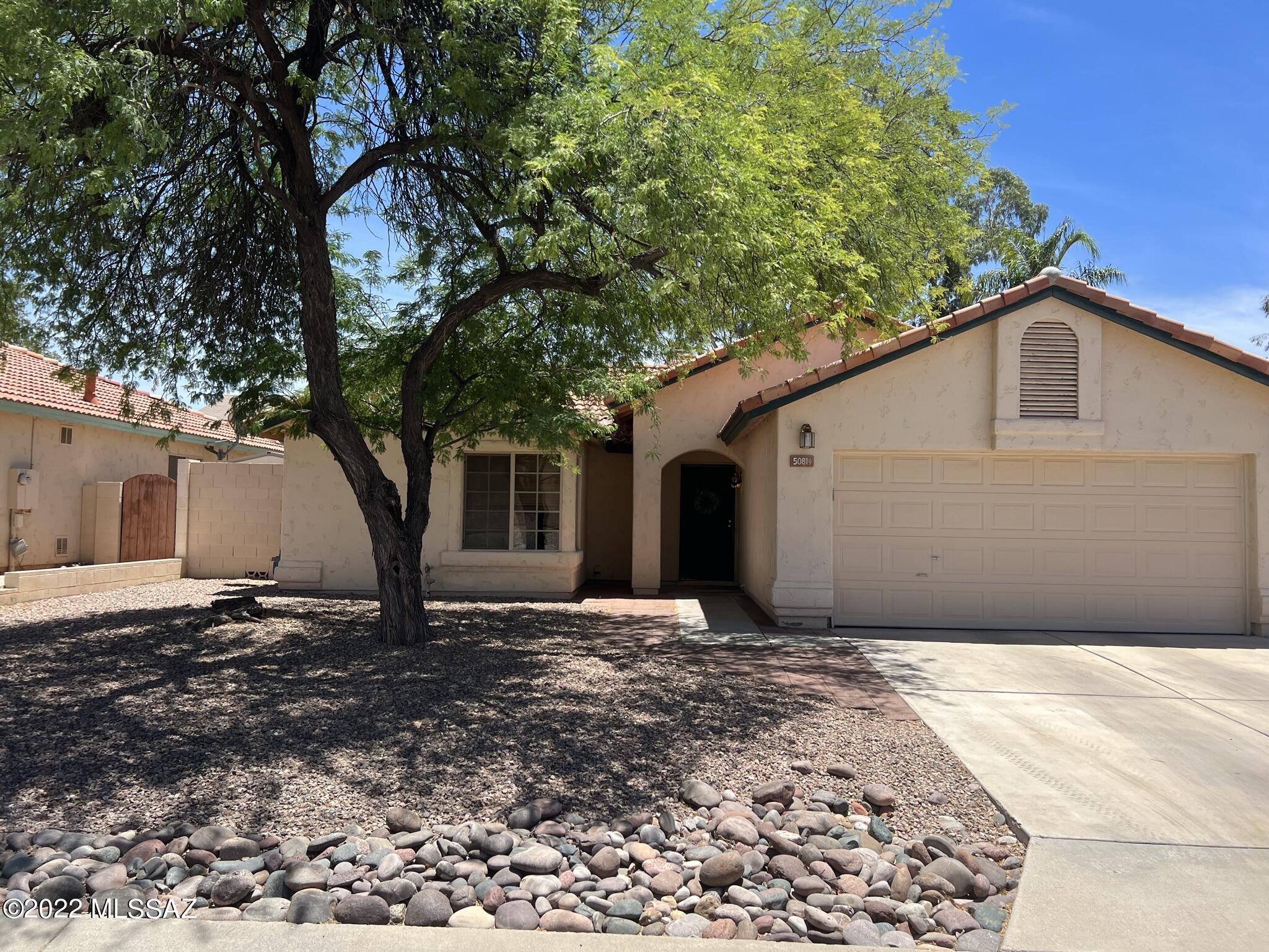Fantastic NW home in Countryside Vista offers it all with 1,281 sq ft, 3  bedrooms & 2 baths, 2 car garage + covered back patio! Tile throughout living room + fireplace, dining area, and kitchen. Functional kitchen has been upgraded w/ granite tile counter tops and breakfast bar that over looks dining area. Bedrooms upgraded w/ vinyl flooring adding to an open feel. Windows have been upgraded throughout, including the sliding glass door. Expansive covered back patio provides ample shade for enjoying the private, enclosed backyard year round. 2 car garage is complete storage & shelving. A complete property with mature mesquite tree providing a canopy of shade. Don't miss out!