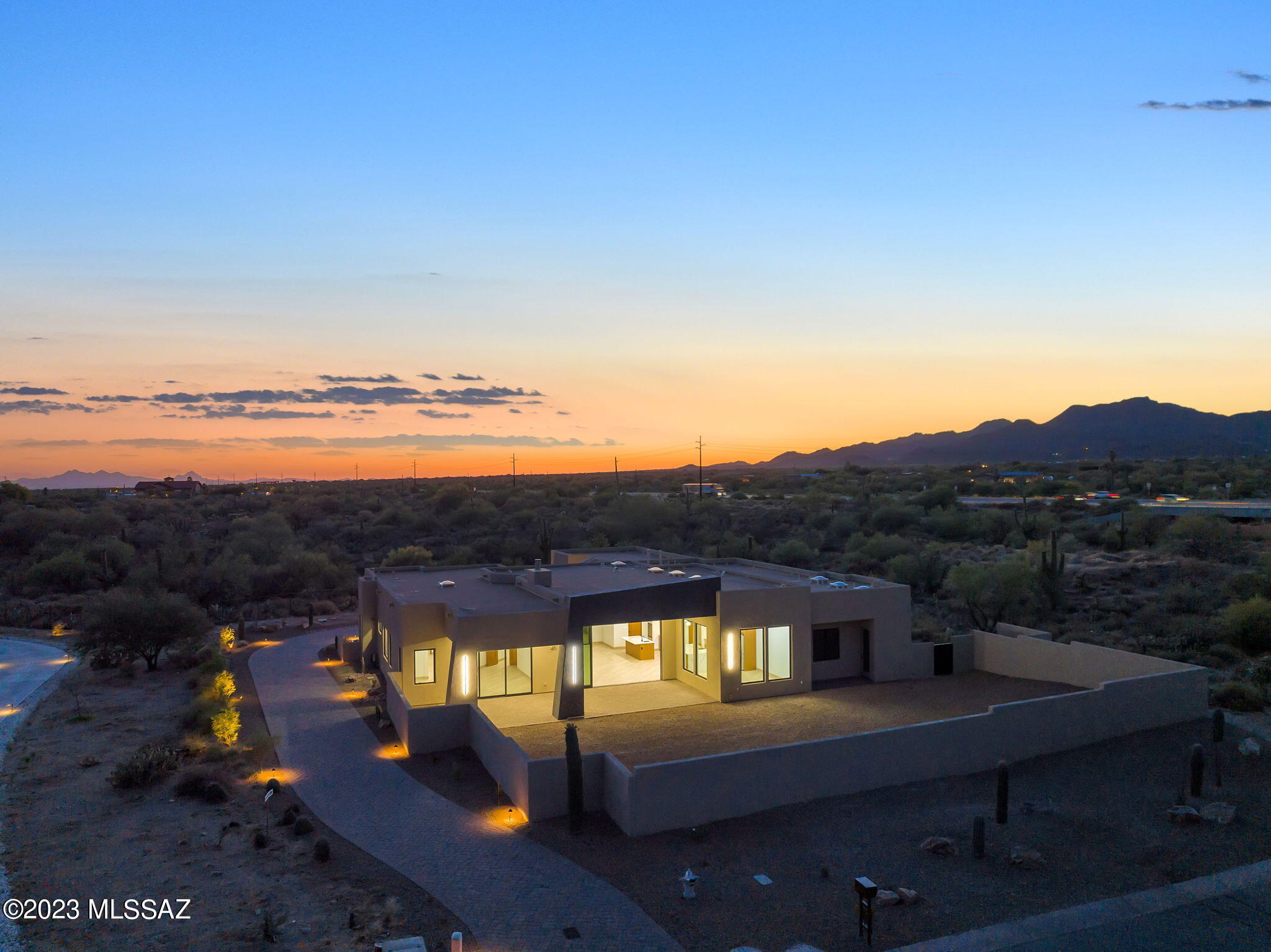 New Construction at sheet rock stage price  ranged  $1,850,000- $2,300,000.  Spectacular  Contemporary  in Oro Valley on 3.4  acre lot by award winning builder Homes by Copper Canyon.  4 bdrm 3 1/2 bath home  with back facing east to capture Catalina Mtn views.  Open floorplan that flows from great room to kitchen and dining nook.  Features include 15' Retractable sliding door, 5' glass pivot entry door with sidelights. High end finishes throughout. The pictures are of this same floorplan built and occupied on another lot in the community.  Builder estimates completion Mid 2026. Call to schedule a viewing and meet with builder.