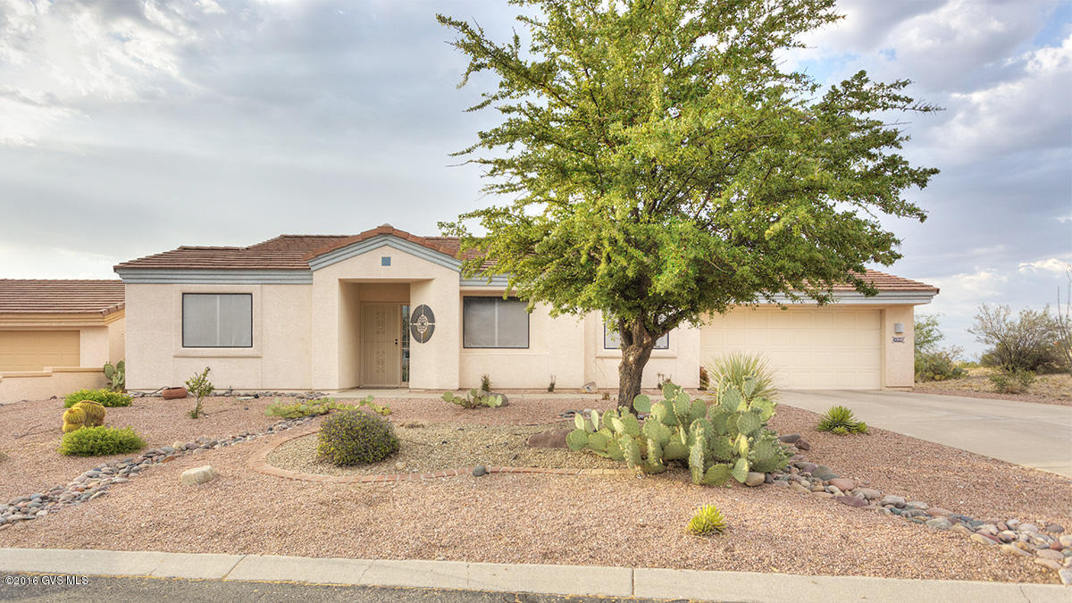 Patagonia model with wonderful finishes. Spit-bedrm floor plan. Laundry room has a huge pantry and large built in office area. Great storage thru out and a big vista in the backyard...golf course, Sierrita Mts, Rincons and even the Santa Ritas! Easy care front yard and fruit trees and desert vegetation in the back. Lots of tile flooring and an open floor plan with vaulted ceiling. A truly lovely move in ready home.