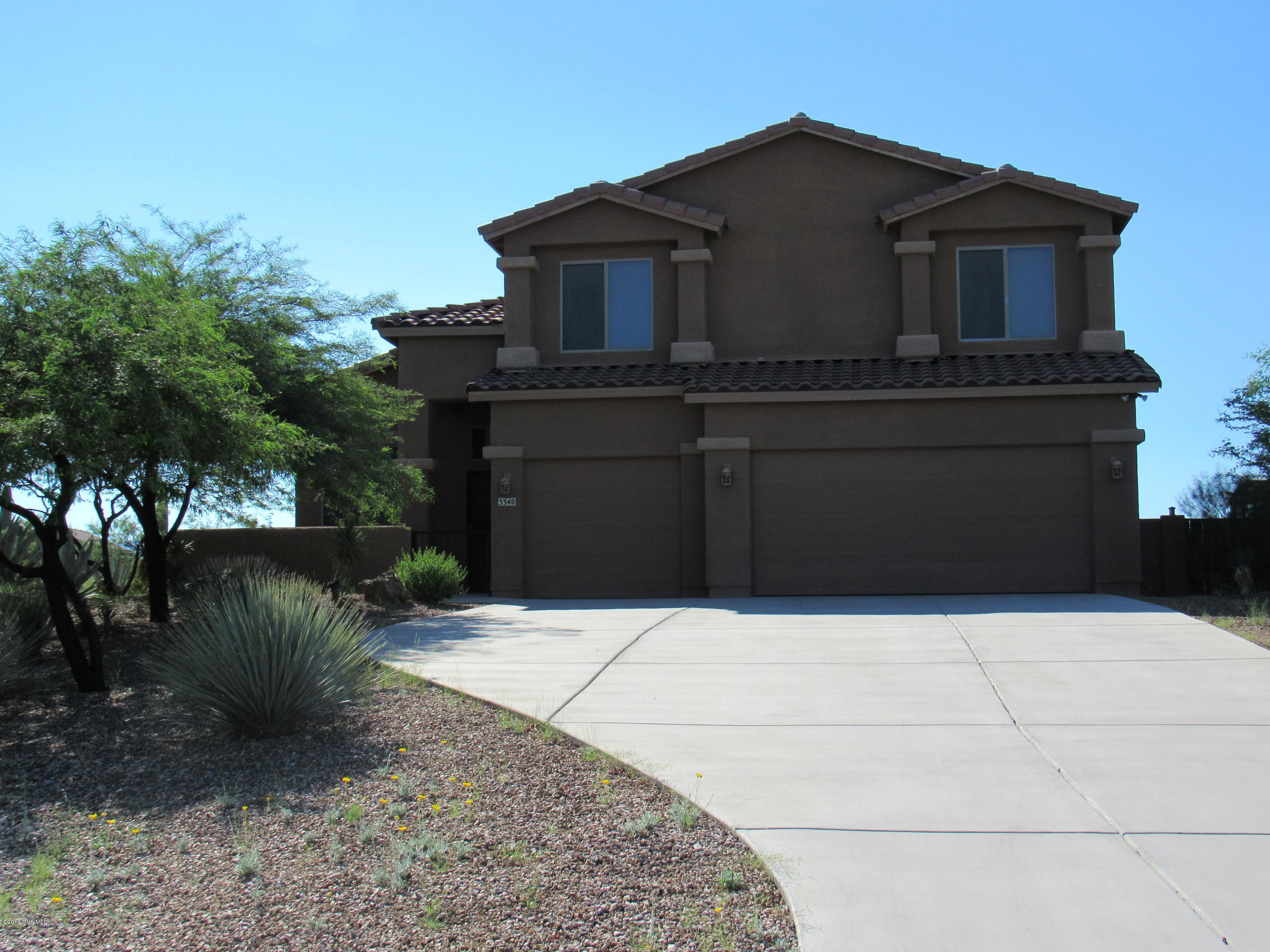 Cozy 2-story Sahuarita home with beautiful scenic mountain views! Lots of space! Large kitchen with plenty of counter and cabinet space, plus an island! Master has separate shower and soaking tub plus walk in closet with built in shelves! Covered and enclosed patio in back! Backyard also features a lovely built in fireplace!