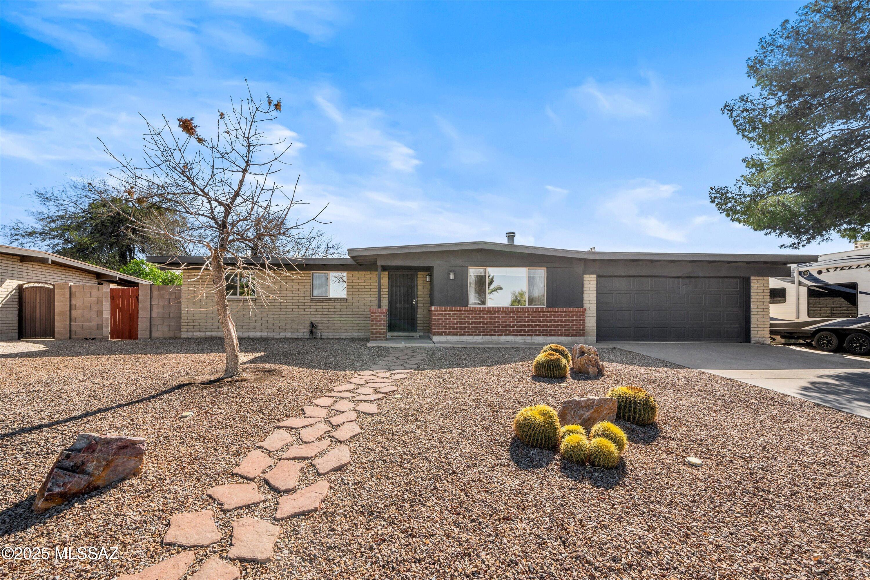 Welcome to this NW Tucson gem in the heart of Heritage Hills with no HOA! This three-bedroom, two-bathroom home is close to everything—within walking distance to the elementary school, shopping, and excellent restaurants. Updated within the last five years, this home features vinyl plank flooring, a bright kitchen with stainless steel appliances, a separate laundry room, and a large family room with a wood-burning fireplace. The backyard boasts beautiful turf grass, a covered paver patio, and a spacious storage shed. Well maintained—HVAC replaced in 2021, roof re-coated in 2023.