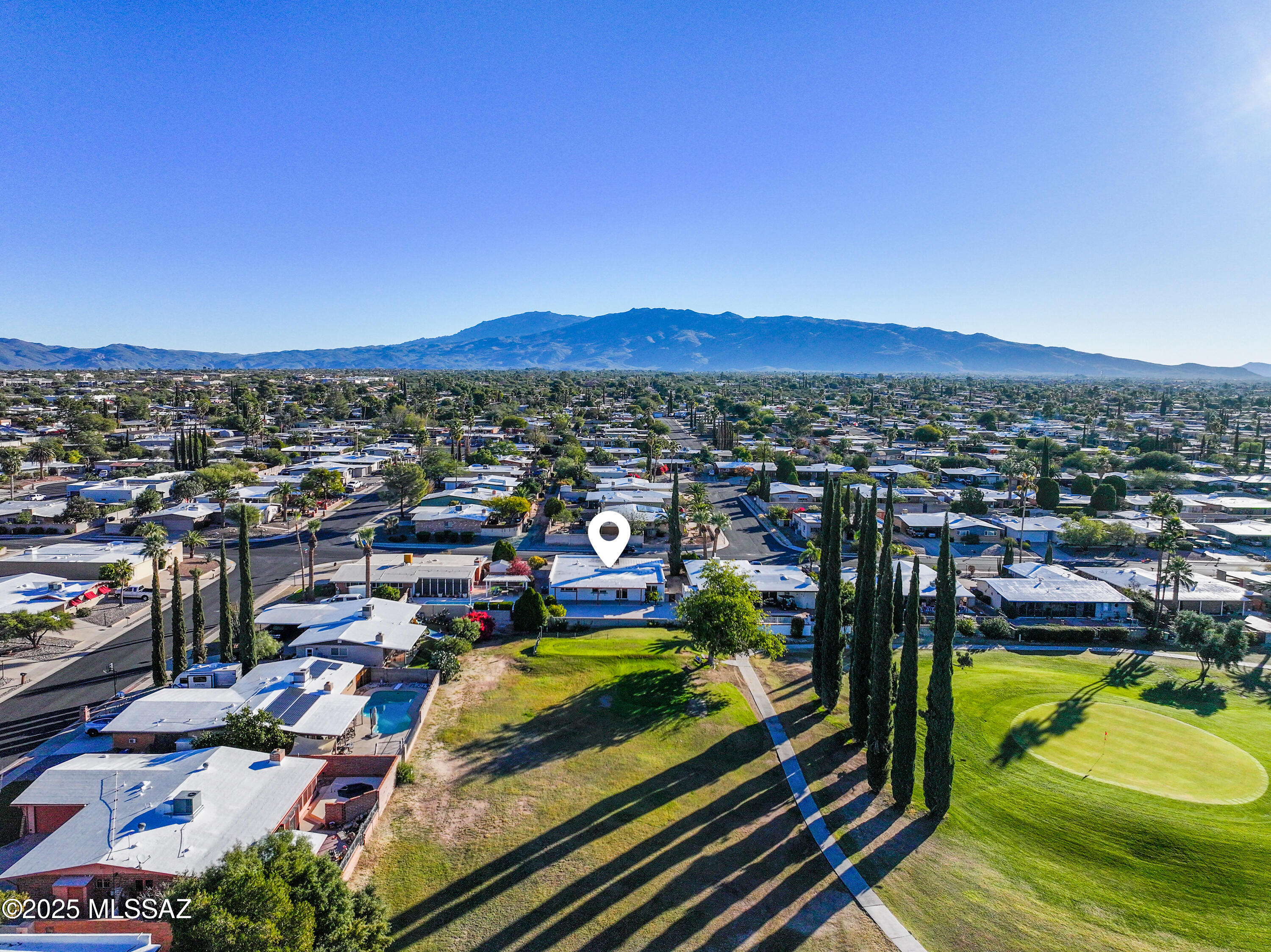 Beautifully remodeled 5BD/3BA, 2,200 sq. ft. home backing directly to Rolling Hills Golf Course with spectacular fairway and mountain views and no rear neighbors. This rare golf-course lot offers peaceful scenery, open green space, and stunning sunset and mountain backdrops right from your backyard. The flexible split floor plan includes a spacious primary bedroom plus four additional bedrooms—one of which is located at the front of the home with its own private bathroom, making it ideal for a mother-in-law suite, guest quarters, or a private office setup. A convenient double-door entry provides excellent flow: one door opens into the great room and front bedroom suite, while the second door leads into the foyer. From the foyer, turn left into the breakfast nook and remodeled kitchen, or continue straight down the hall to the primary bedroom and three rear guest bedrooms.    This home has been extensively remodeled with all new energy-efficient windows and sliding door, new flooring throughout, all new cabinetry, quartz countertops, vanities, lighting, and more. Flooring includes plank-style flooring in the primary bedroom, front bedroom suite, and all common areas, with carpeting only in the three rear guest bedrooms.  The kitchen and bathrooms have been fully updated with white shaker cabinetry, quartz counters, modern fixtures, and clean tile surrounds. The bright kitchen features a large picture window framing beautiful golf-course views, stainless steel appliancesincluding a Samsung glass-front refrigeratorand a breakfast nook overlooking the course for a scenic daily dining spot.  Step outside to a low-maintenance backyard with large paver patios, gravel landscaping, mature shrubs, and two fruit treesperfectly positioned to enjoy the tranquil golf-course ambiance. A truly move-in-ready home in a desirable neighborhood, offering comfort, flexibility, and unmatched views overlooking Rolling Hills Golf Course.