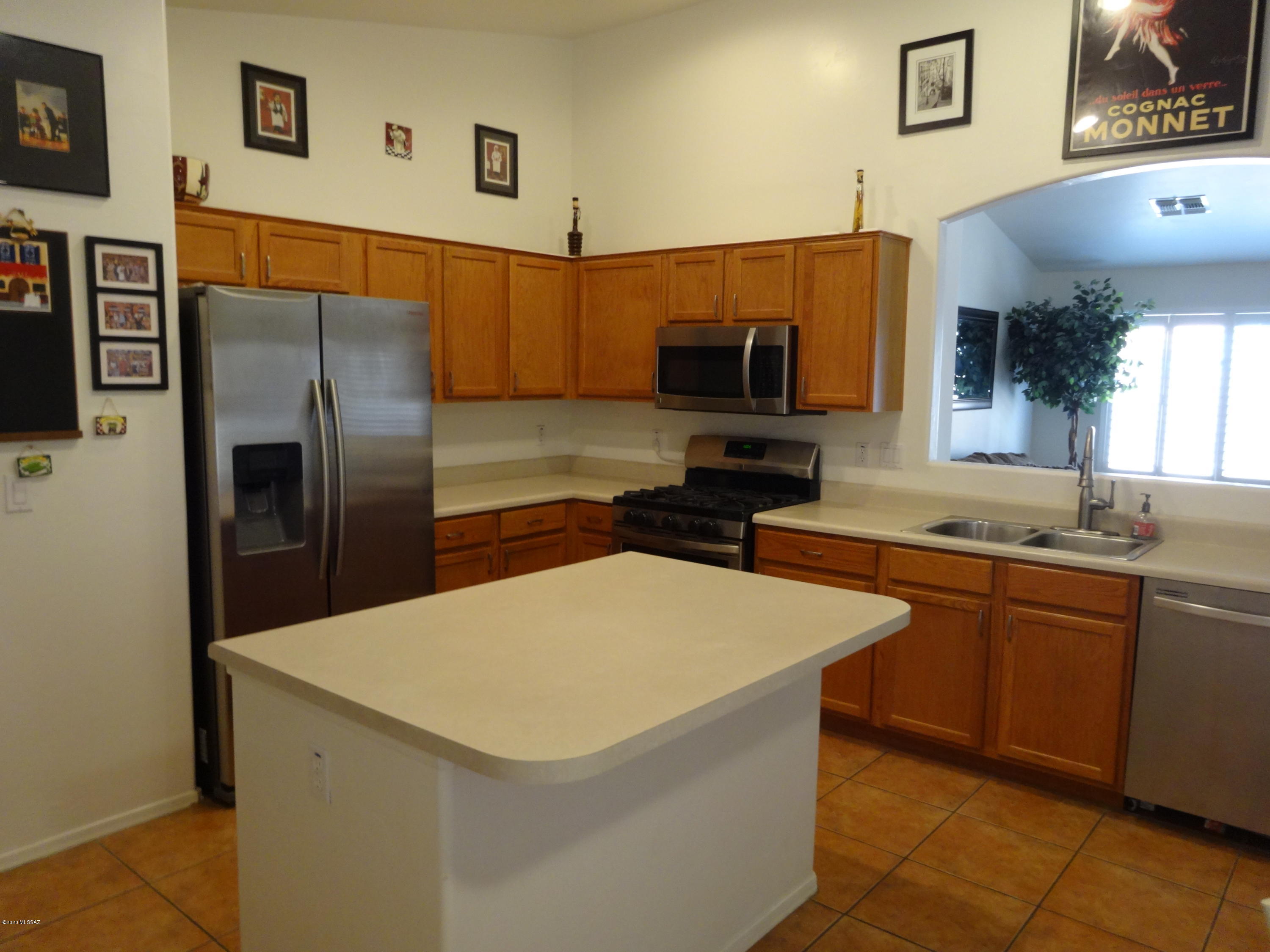 Step inside the home that you've been dreaming of, this single-story 3 bedroom 2 bath home and neighborhood have so much to offer.  It has vaulted ceilings, Wood Shutters, 3 car garage, Kitchen island, updated stainless appliances new flooring in living area and recently new exterior paint.  Front and back yard low maintenance landscaping.  The neighborhood amenities include close proximity to I-10, shopping, hiking, schools, parks, medical facilities, community pools, skate park, and splash pad.  Don't miss out!