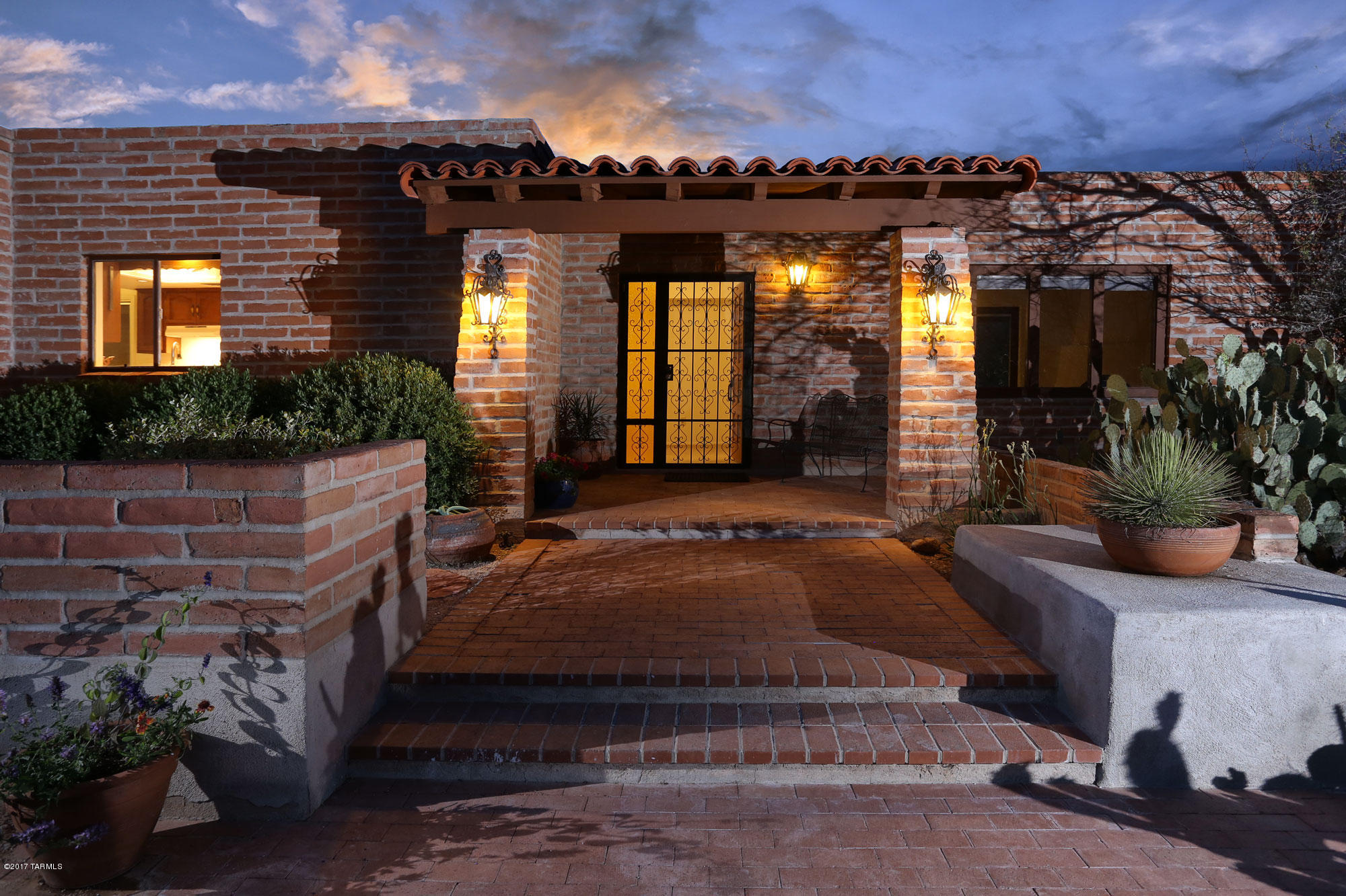 1st time ever on the market! One owner Gary Almli custom built adobe home on almost an acre mountain view lot. Wonderful floorplan features 3 bedrooms plus a den and sitting room, 4 bathrooms and multiple covered patios. Large windows in all the right places. No interior steps or swimming pool. This easy care home offers a gracious lifestyle from a very convenient Foothills location. New tile throughout as well as updated bathrooms. Double ovens, Corian counters and a breakfast area round out the step saving kitchen. Abundant storage. The outdoor space and views are the crown jewel of this fine property. Long circular driveway and side entry garage are the perfect approach. Heating and A/C less than 2 years old. Close access to the U of A, Downtown, Shopping and restaurants.