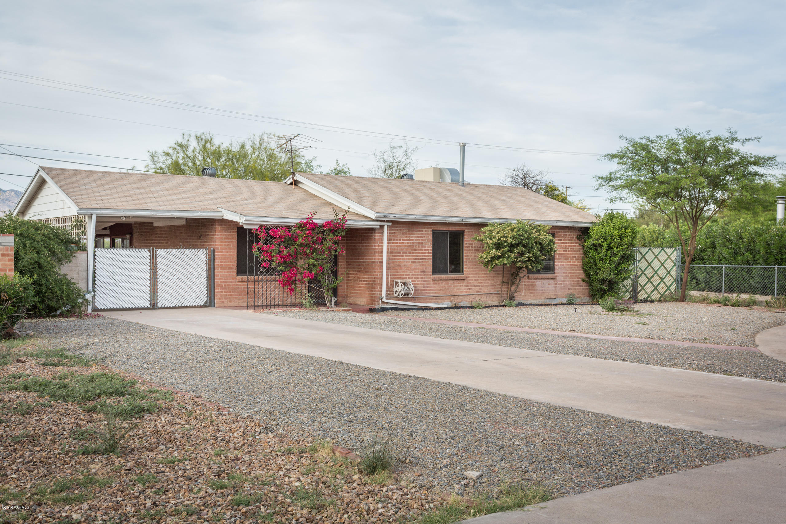 Charming solid brick construction home with 3 bedrooms 2 baths.  Large arizona room and workshop/studio.  Gally kitchen with eat in dining includes all appliances.  Updated bath with tile surround and corrian counter. Ceiling fans in all rooms.  Extended brick paver patio. Home is tucked away from busy streets but close to shopping, dining, medical and schools.
