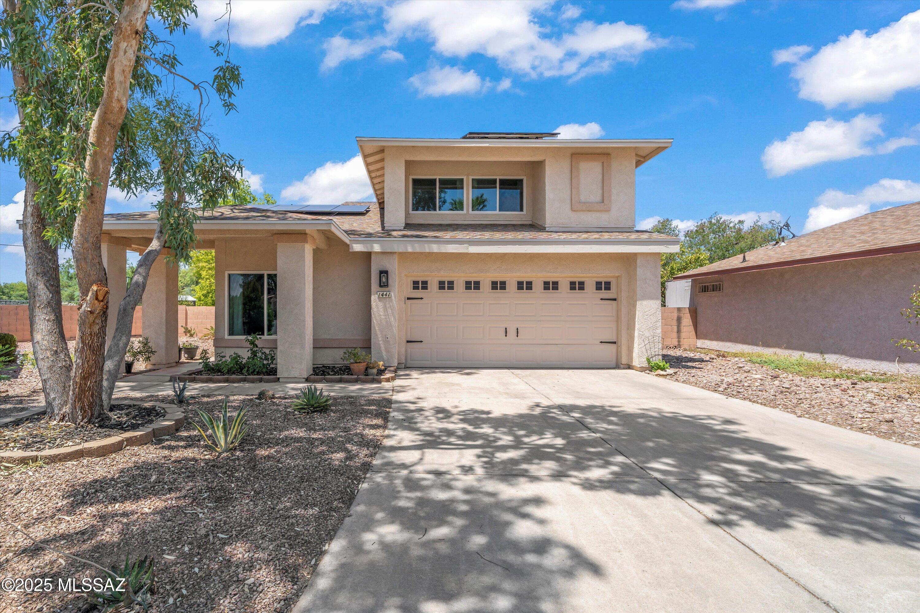 Price Ranged: $300,000 - $310,000. Desirable corner lot features one of the largest backyards within this desirable east side community. A charming 3-bed, 2.5-bath home on a corner lot in Tucson's desirable east side. This two-story home has a cozy main level with updates in the kitchen (including newer stainless steel appliances) separate living and family rooms, dining room, remodeled half bath, and a playroom/storage area under the stairs. All bedrooms are upstairs for added privacy, while the spacious living areas below are ideal for entertaining. Upstairs bathrooms have been remodeled with modern tile surrounds. The generously sized backyard offers recent landscape improvements, including lush grass, mature trees, and a covered patio perfect for relaxing or hosting. With a 2-car garage and a quiet HOA community with amenities nearby, this home offers comfort, charm, and convenience. Solar panels have reduced energy cost with loan that requires Buyer assumption.