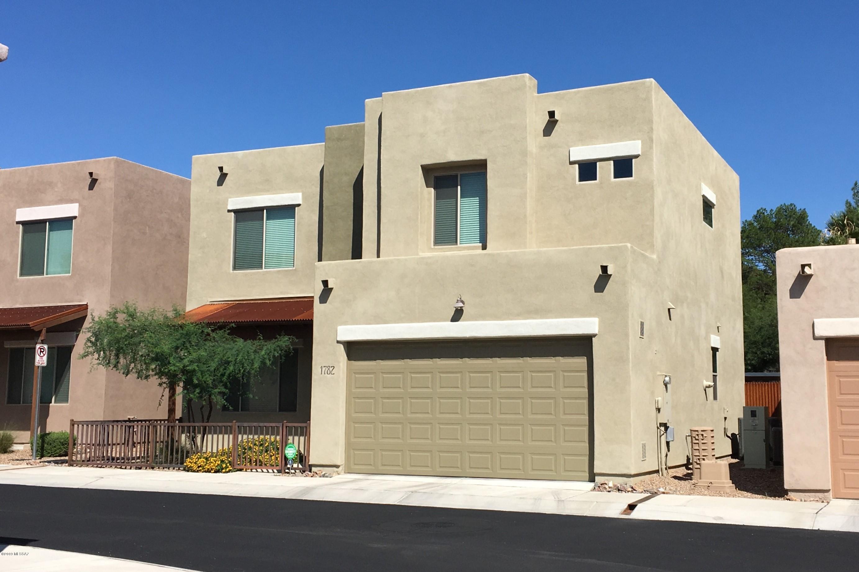 Built by Mesquite Homes, Tucson's hometown builder, in an ideally located gated community just off Tanque Verde's Restaurant Row, minutes to Cost Co., shopping, and hospitals.  Barely lived in and just like a brand new model home.  Green Features include tankless water heater, 14.5 SEER AC, Energy Star certified with HERS rating.  The utility savings is significant.  All this and a soothing color palette, beautiful tile floor, window blinds, upgraded lighting/ceiling fans, generous size bedrooms, ample closets, upscale baths with designer touches, court-yard entry, and landscaped back yard with patio.