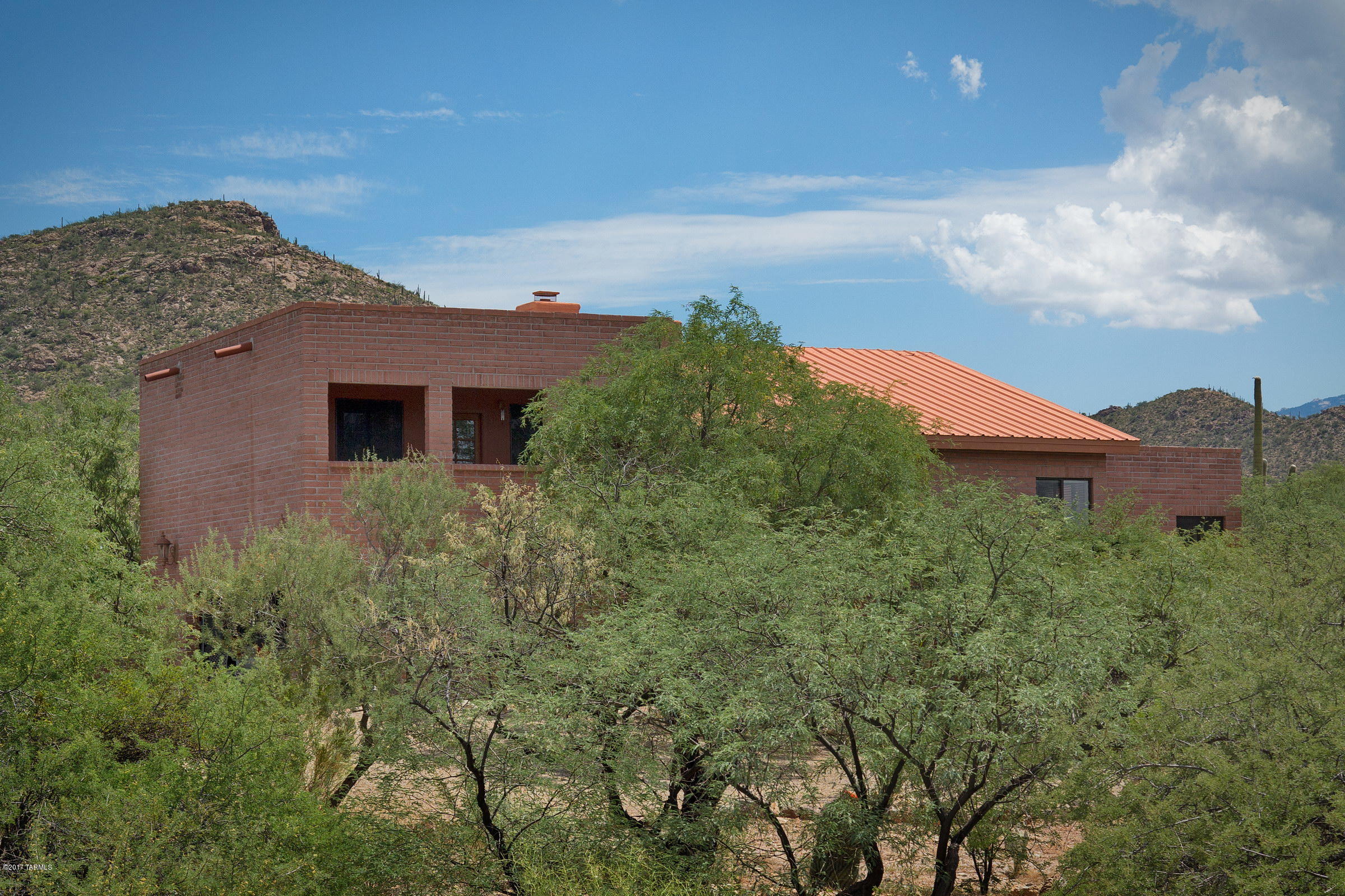 Beautiful Mountain views from almost every window in the home.  Built in 1994, this masonry block home has 3 bedrooms plus loft & 2.5 baths. Kitchen offers a pantry, built in microwave, electric cooktop & built in convection/conventional oven. Large family room has picture windows to capture the mountain views, cathedral ceilings, floor to ceiling wood burning fireplace and newer Pella doors that lead to the backyard. Master suite has jetted tub, separate shower & walk in closet. If you’re lucky enough to get the 2nd bedroom, you can enjoy a private balcony with great views! The covered patio provides lots of shade to enjoy the natural desert backyard which welcomes the desert animals from javelina to deer. A walled in side courtyard off the family room offers privacy & serenity.