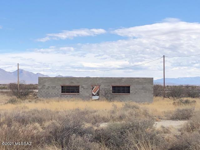 Brick Warehouse building, built in 1986. Concrete slab, 1512 sf, opening for a roll up door, roof is gone. Buyer to verify physical access and utilities.