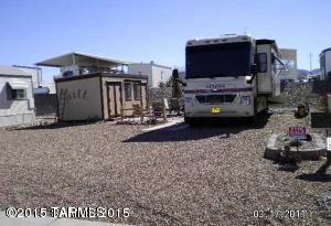 Small town of Benson provides churches, hospital, shopping, restaurants, golf. Cochise Terrace lot w/shed, space for your RV. Putting green on property.