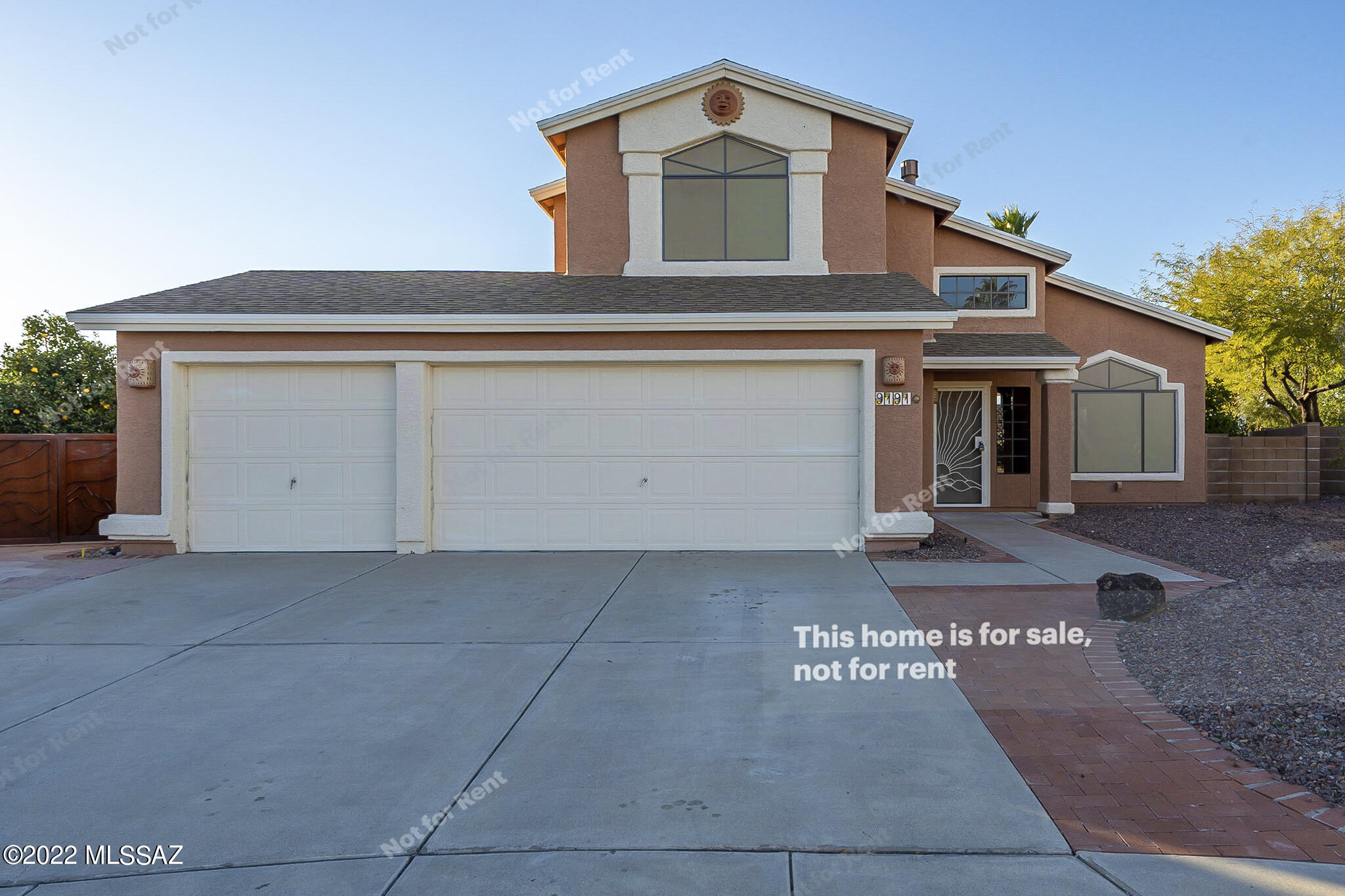 This Tucson two-story cul-de-sac home offers a patio, and a three-car garage. This home has been virtually staged to illustrate its potential.
