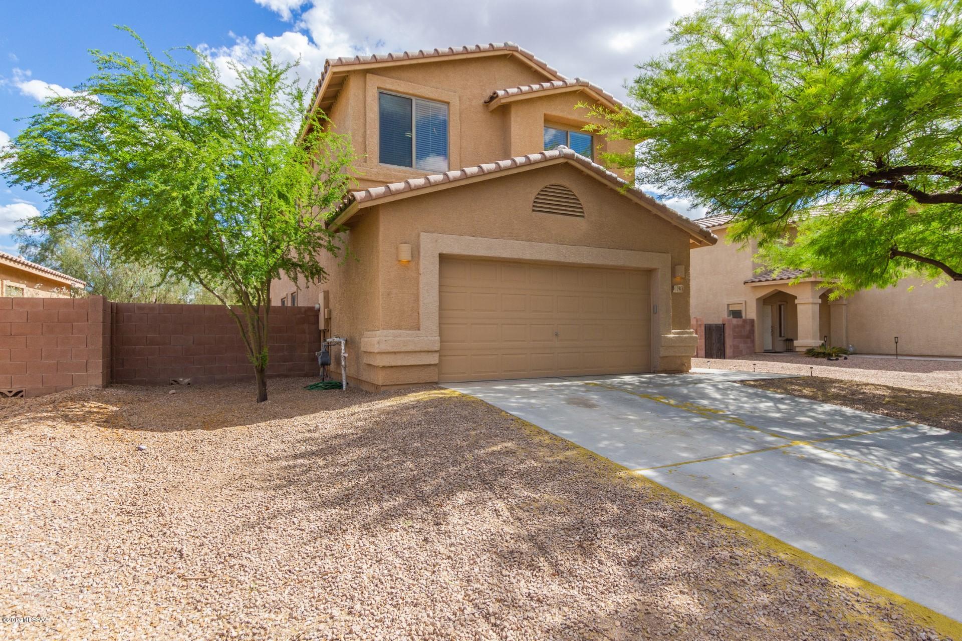 Nestled in the Rancho Marana Community is a beautiful 2,087 sq ft home! Charming curb appeal with mature trees welcomes you to soaring ceilings, formal living and dining room with natural lighting, custom color scheme and a powder room on the first floor.  Off the kitchen is the living room creating the perfect entertaining space. Oak cabinetry, black appliances and a gas stove. Upstairs is the spacious master suite with walk in closet and full ensuite. Double sink vanity, and private toilet room. Your outdoor space is primed and ready for your personal touches. Don't miss out on this gem!
