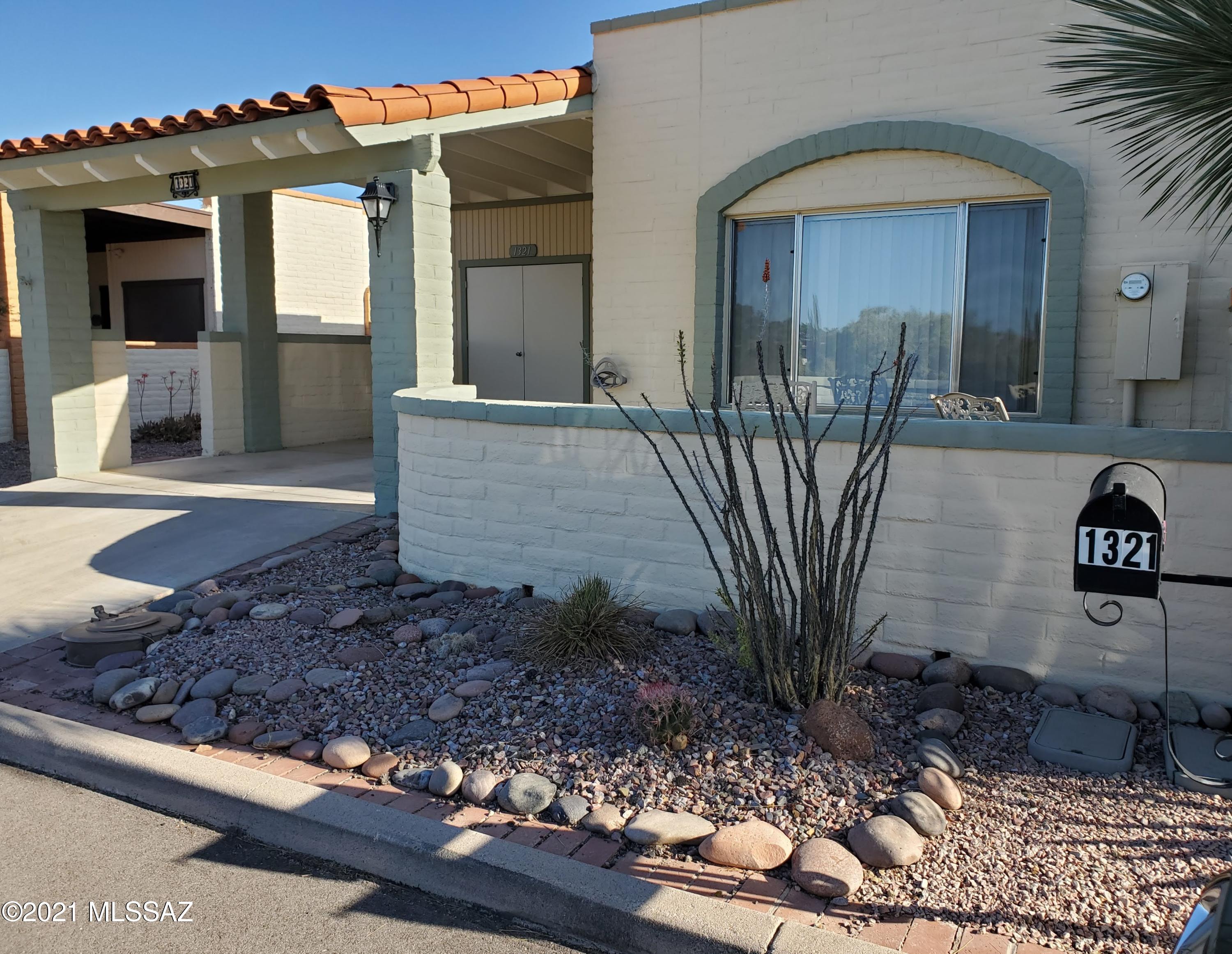Enjoy a peaceful setting, open skies with mountains in the distance from the front courtyard of this 2BR, 2BA  end unit. There is a bonus golf cart garage & an air conditioned ''secret room'' off the screened- in back porch. Rightfully named ''Cozy Cottage'' by the owners this townhouse is spotless, delightfully furnished and decorated. Perfect for full or part time living or a rental because all the furniture, accents, linens & dishes on-site are included! Every room is updated. Granite counters & back splash in the kitchen, stainless appls, Whirlpool glass top range w/convection cooking. Baths boasts tile shower surrounds & dual flush toilets. Large screened in porch with a picnic table leads out to a private, easy care rear yard complete with a grill.