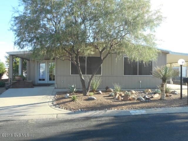 WOW!! If you want a home ''move in ready'', don't miss out on this one. Kitchen redone with Ikea cabinets. stainless steel appliances and tile flooring. Interior newly painted and all flooring replaced. Hall bath redone along with Master bath counter and cabinets. Bonus/laundry room with storage cabinets. Enclosed Arizona Room (not included in square footage), east wall has extra insulation. Resided exterior with added insulation. New foam roof in 2014. Most furnishing available by SBOS. Well landscaped. 2 covered porches, one has some mountain view. Huge workshop/storage off 2 car carport. HOA $50.00 mo. includes tash pick up, great recreational facilities, heated pool and spa. Library, ceramic, billiards, exercise rooms, etc. Close to shopping, quality medical care, restaurants and  golf courses.
