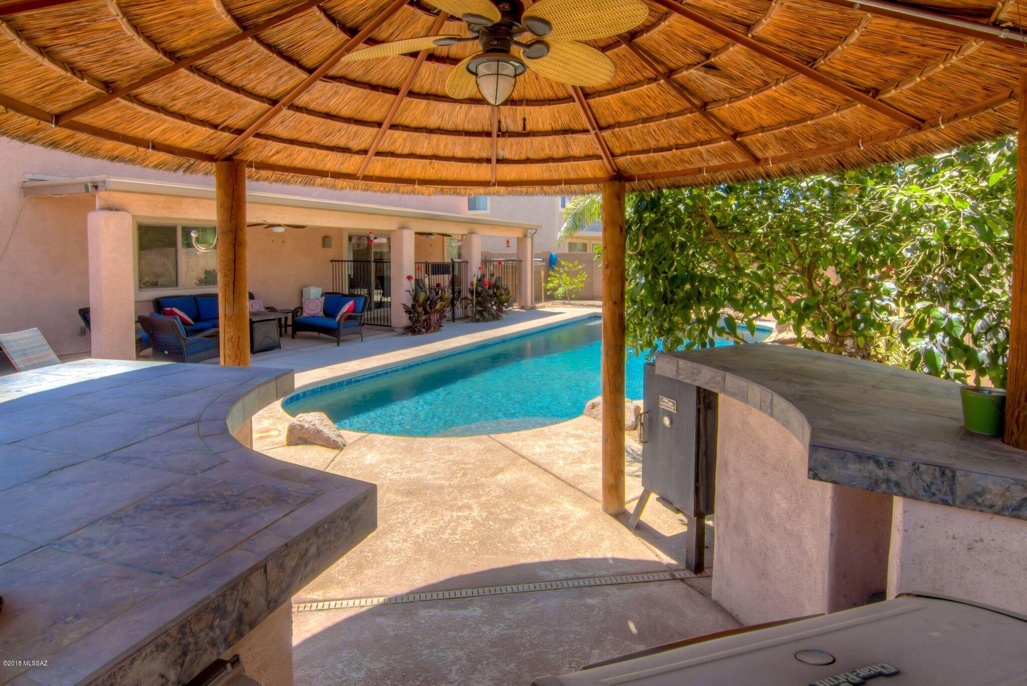 Living is easy in this immaculate and expansive Gladden Farms home! Generously spaced floorplan features plenty of room for entertaining with large common areas, and a huge loft perfect for study time or relaxing with friends and family. Host summer get togethers in your tropical paradise backyard featuring a salt water Pebble Tec pool with water feature, exotic lighted ramada with plenty of room for outdoor kitchen, hot tub and extended patio space all overlooking citrus trees, Sago palms and vibrant floral shrubs. Inside, the kitchen features SS appls, Corian counters, enormous center island and breakfast nook! Upstairs, the expansive Master bedroom is a parent's private retreat w/ sitting area and a walk in closet to die for! Plenty of room for everyone and extra storage throughout! Seller will consider all offers between 325,000 and 340,000. Seller will offer generous carpet/paint allowance with acceptable offer.