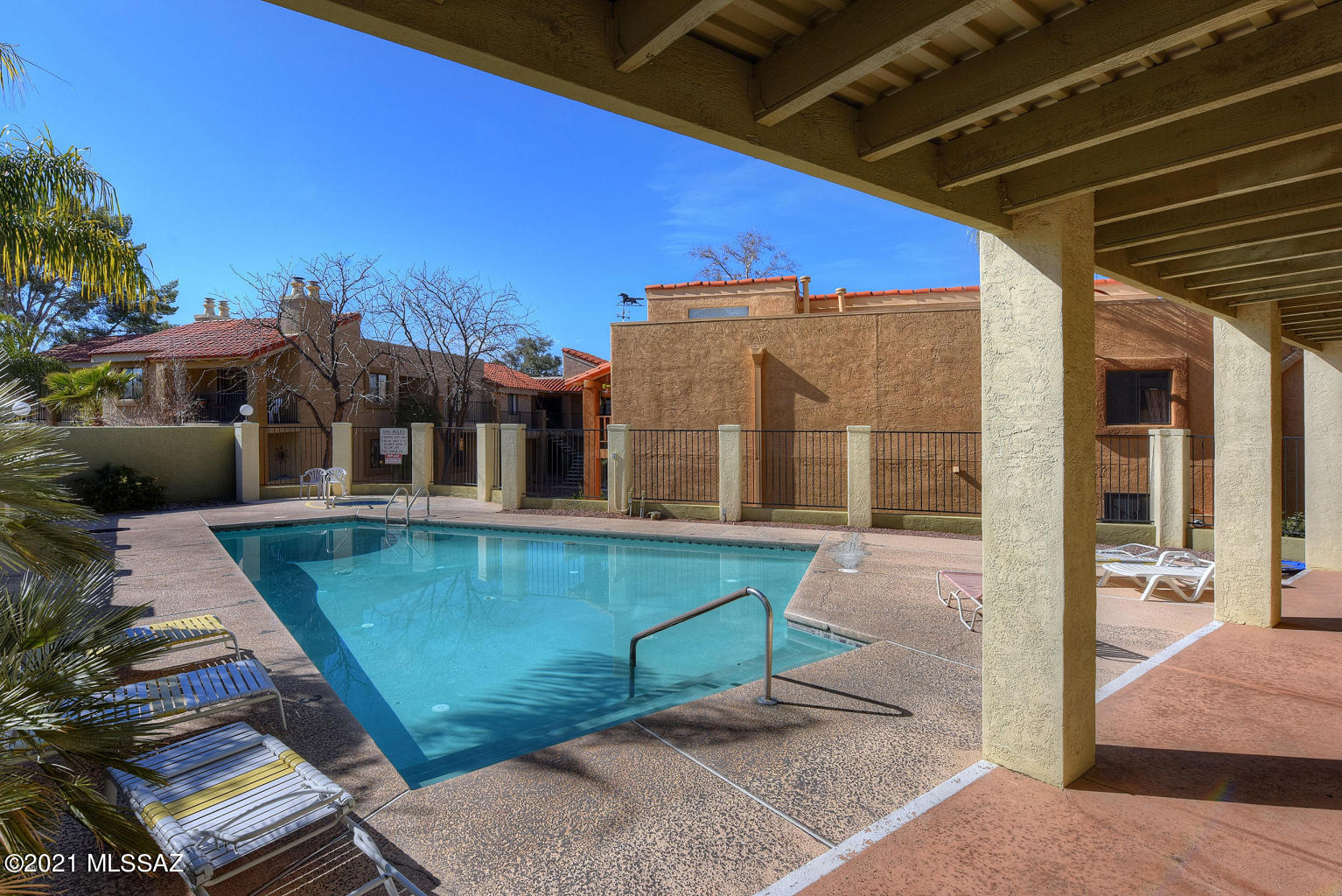 Beautifully remodeled modern condo. Move in ready, and updated which includes new carpeting, paint, updated tile back splash and updated bathrooms. Fireplace included in living area with a separate dining area. Two bedrooms and baths in a split floor plan. Home includes washer and dryer and stainless steel appliances. Inviting pool, spa and club house are included.