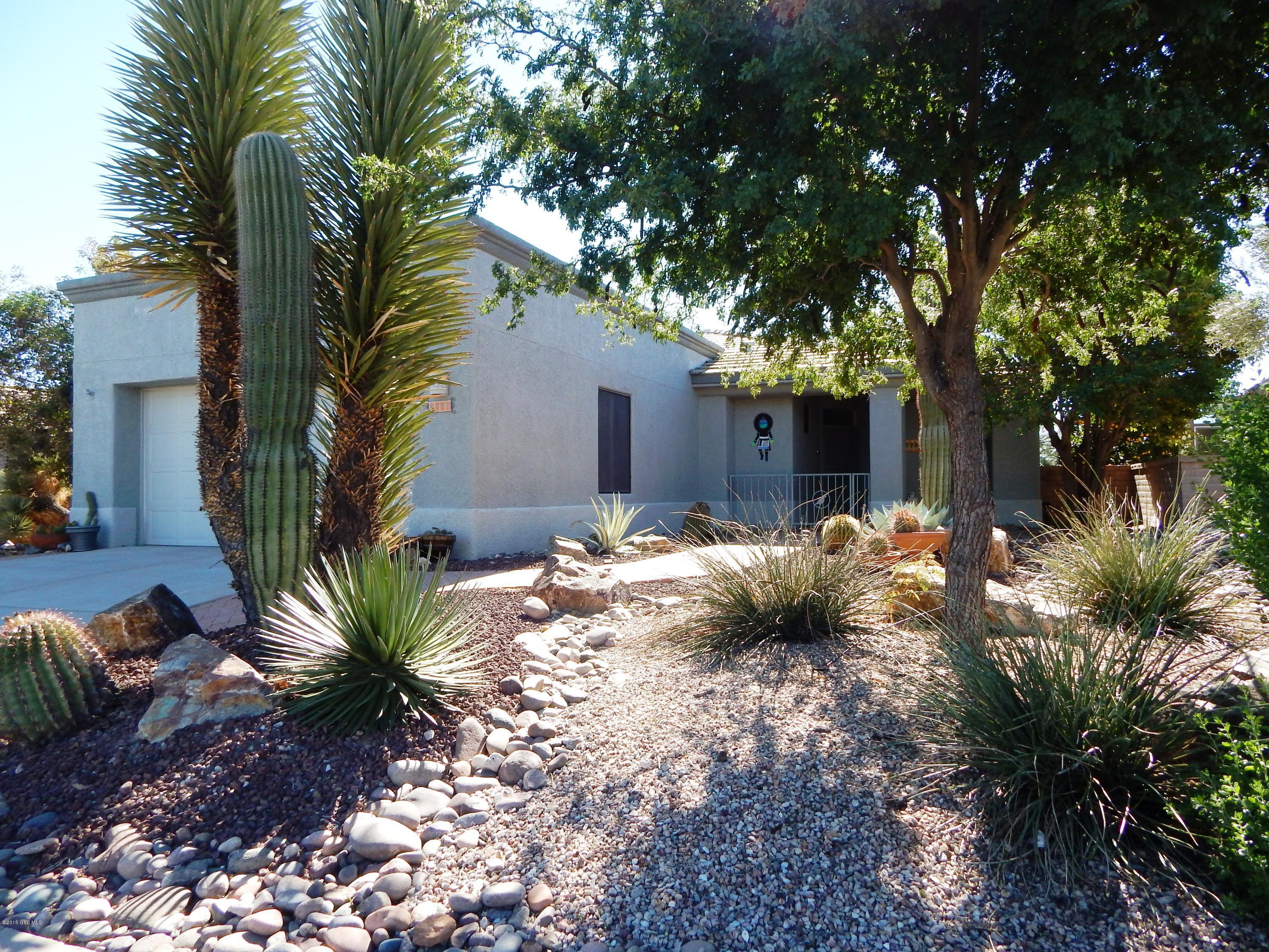 This beautiful two bedroom, 2 bath plus den home is located in the very popular community of San Ignacio Vistas. The home has a functional split bedroom, open concept layout with neutral tile in the entry, kitchen, pathways and bathrooms. The kitchen has unique counter tops with Hopi tile inlays and stainless steel appliances. The home has neutral paint, ceiling fans and plantation shutters throughout. You are sure to enjoy the private screened patio and a terrific Santa Rita mountain view! Don't miss this very well maintained home with all its terrific upgrades and features.