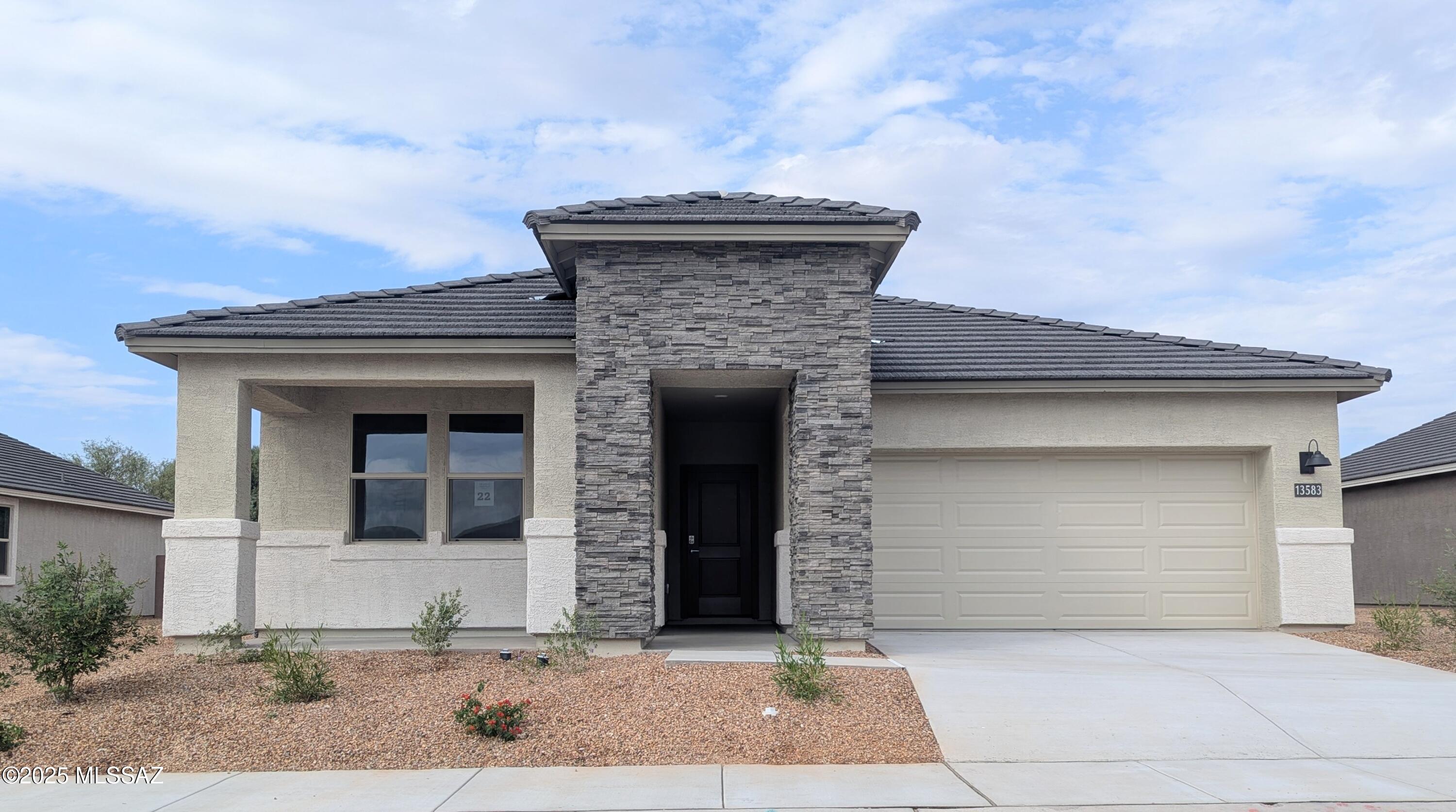 Introducing The Dalea at Barnett Village, Marana, Arizona - a perfect blend of comfort, modern living, and energy efficiency. This thoughtfully crafted one-story home spans 2,058 square feet and offers five bedrooms, 3 bathrooms, ideal for families of all sizes. The open-concept design features a spacious great room that effortlessly connects with the kitchen and dining area, creating an inviting central hub for everyday living and entertaining. The kitchen is equipped with contemporary appliances and a pantry, offering ample storage and convenience for meal preparation. The primary bedroom, located at the rear of the home, provides a peaceful retreat with a private ensuite bathroom and a generous walk-in closet. The additional four bedrooms are positioned at the front of the house, offering versatility for use as guest rooms, a home office, or children's bedrooms. The Dalea floor plan offers the option of a three-car tandem garage, perfect for additional space and larger sized vehicles. Whether it's morning coffee or evening relaxation, this outdoor space extends your living area into the serene landscape of Barnett Village. Built with energy efficiency as a priority, the Dalea includes smart home technology, which not only simplifies daily living but also helps reduce utility costs. With the TANDEM Garage Option, this home provides ample parking, or extra storage space as well!
This home is under construction with an estimated completion of September/October 2025.