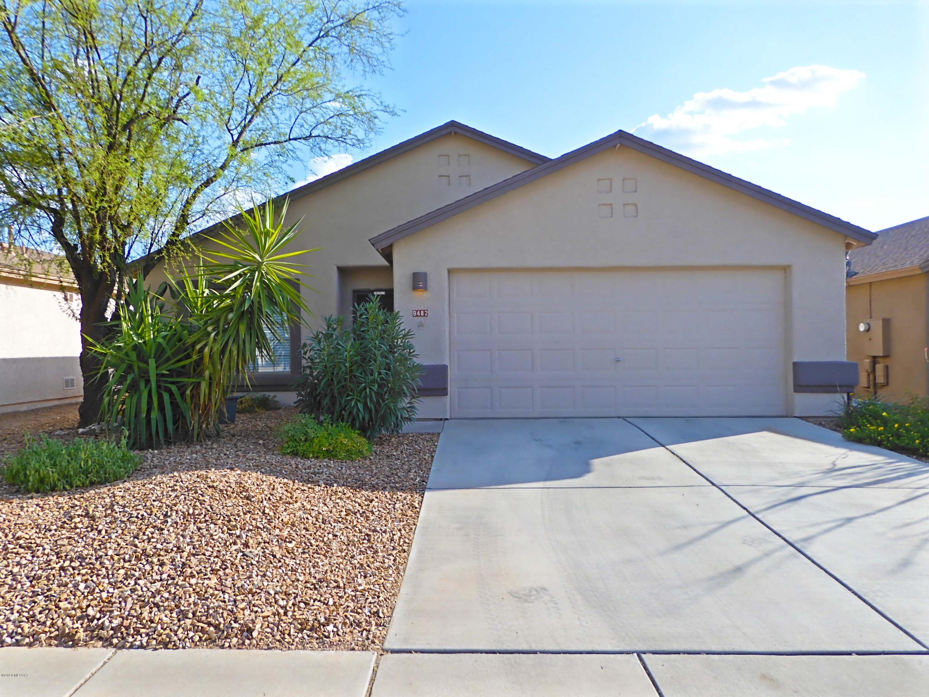 This cheerful & bright contemporary home features No Carpet, 3br/2ba, 2 living rooms, kitchen island, laundry room and a 2-car garage in desirable Rita Ranch. Kitchen with Built-in SS microwave, SS Dishwasher, SS Electric Oven/Stove, SS fridge & pantry. High ceilings throughout. Ceiling fans in all Rooms. Spacious Master Bedroom with Walk-in Closet, Built-in Closet System, double vanity, soak tub & separate shower. Covered patio & backyard w/ no neighbors behind. Vail Schools, close to Super Walmart, Fry's supermarket, quick access to freeway & close to major employers. Near popular Purple Heart Park (dog parks, skating park, public swimming pool, etc). 2 small pets Ok. This is a must see home for rent! Non Smoking Home. Renter's Insurance required. **Front Yard Tree Has Been Removed**
