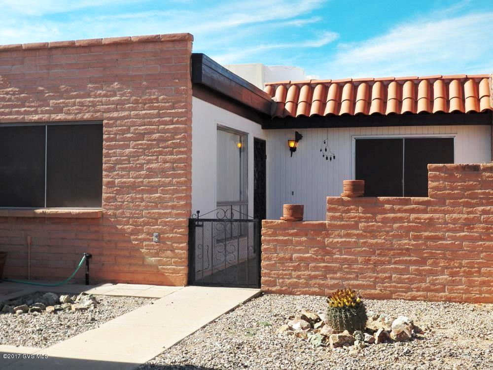 Furnished easy care, no worries 2 bedroom, 2 bath townhome ideally suited as a winter/seasonal home. Just off the back patio is a popular walking/bike trail following a natural desert arroyo and with it comes an abundance of wildlife and colorful flora. Immerse yourself in this scenery in the comfort of a screened patio. During one of our many warm, sunny winter days stroll over to the nearby pool for a relaxing afternoon