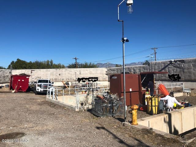 Lot only secured by 12' block wall that is insulated, barb wired across the top and huge metal doors for the perfect contractor yard, or storage. This is a unique parcel that sits way off the main the road but has easy access. Seller is willing to trade a portion or all of proceeds for something more usable for him. Buyer will be responsible for locating utilities and verifying zoning use. This unique lot will not last. Call for more information.