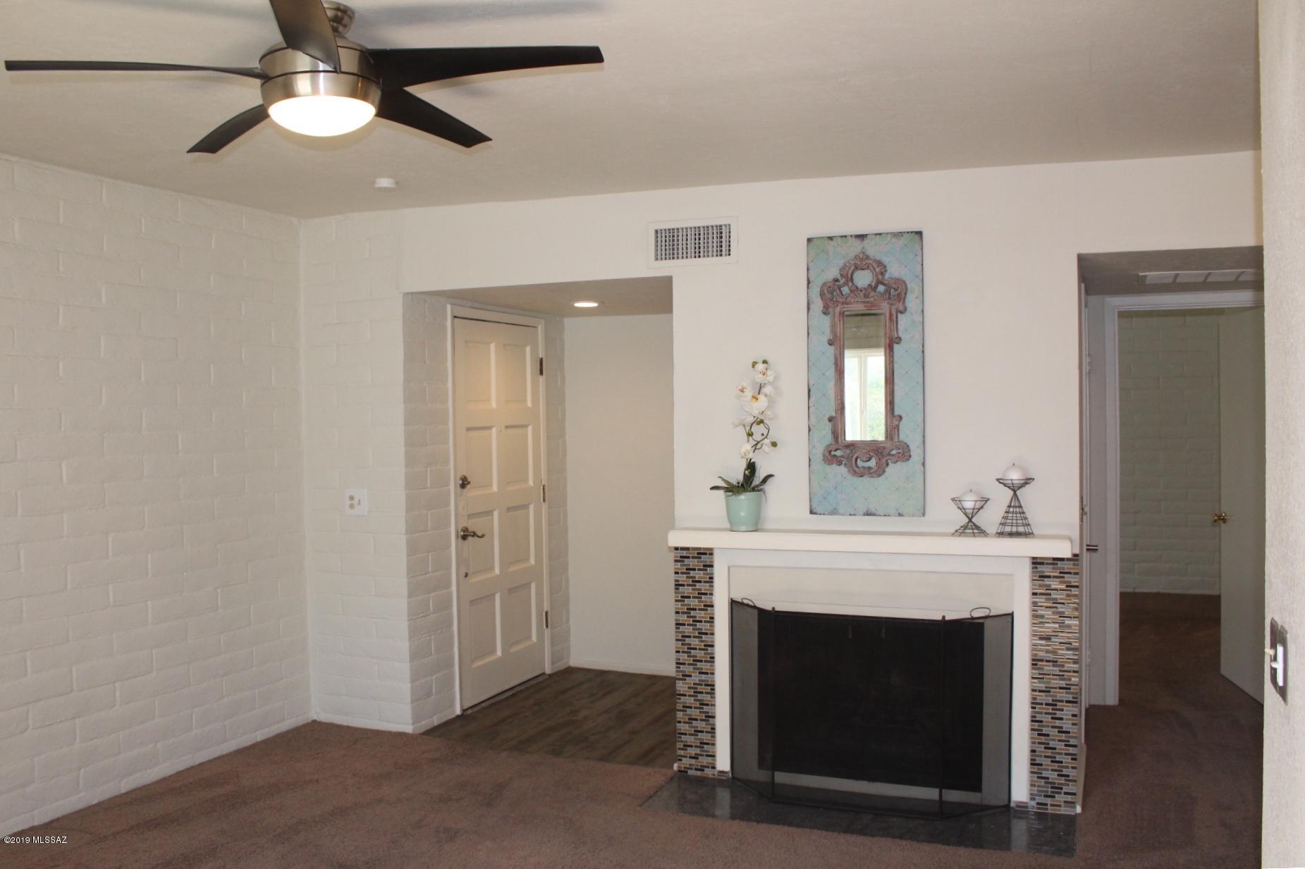 This fully remodeled 2nd floor 1 BD/1BA condo w/Den will instantly make you feel right at home! You'll love the kitchen with tile counters, modern backsplash and wood laminate flooring. All appliances stay!  Open and airy with lots of natural light, the floor plan has a very spacious feel.  Has all new dual pane windows, recently re-coated roof, newer A/C, and updated electrical. This unit also has it's own private covered balcony with a laundry storage room. Not all units have this!  Washer and Dryer stay!   HOA covers water, trash/sewer, ext maintenance, pool, spa, rec center and roof. Property is close to Bike Loop ,Davis-Monthan AFB, restaurants, shopping and on the bus line.  No work needed on this one. Absolutely Move-In Ready!