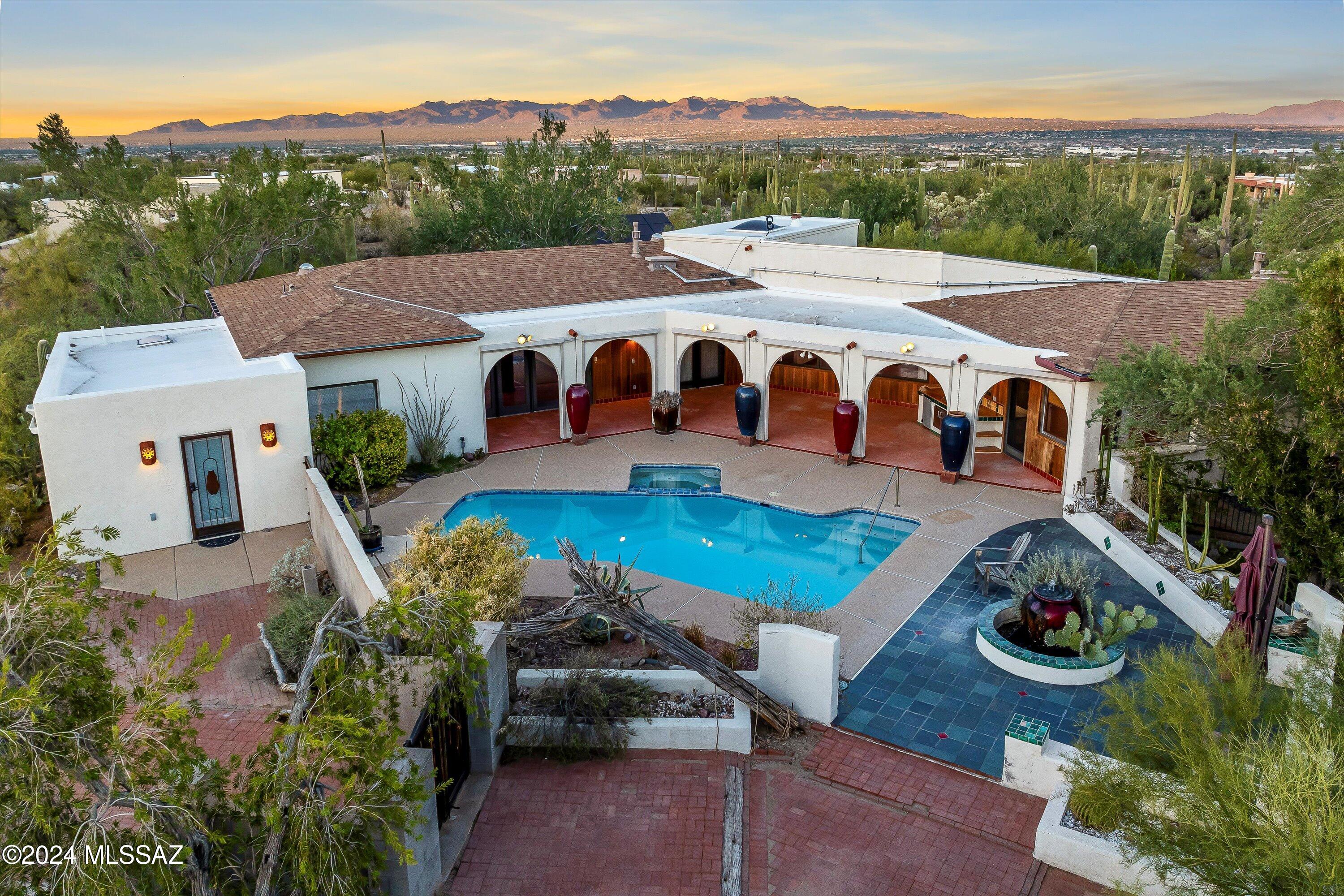 Welcome to your extraordinary custom home, nestled within a breathtaking 4.6-acre oasis adorned with other 40 majestic trees serene nature trails. This stunning residence boasts a charming casita/ guest quarters for visiting friends and family. ensuring perfect relaxation and entertaining. The home showcases exquisite wood trim and soaring high ceilings that elevate the spacious living areas/ Enjoy panoramic views of your picturesque landscape, complete with several citrus trees that add a touch of flavor to your tranquil paradise. Experience the ultimate in luxurious living! This property is more than a home; it's your private haven.