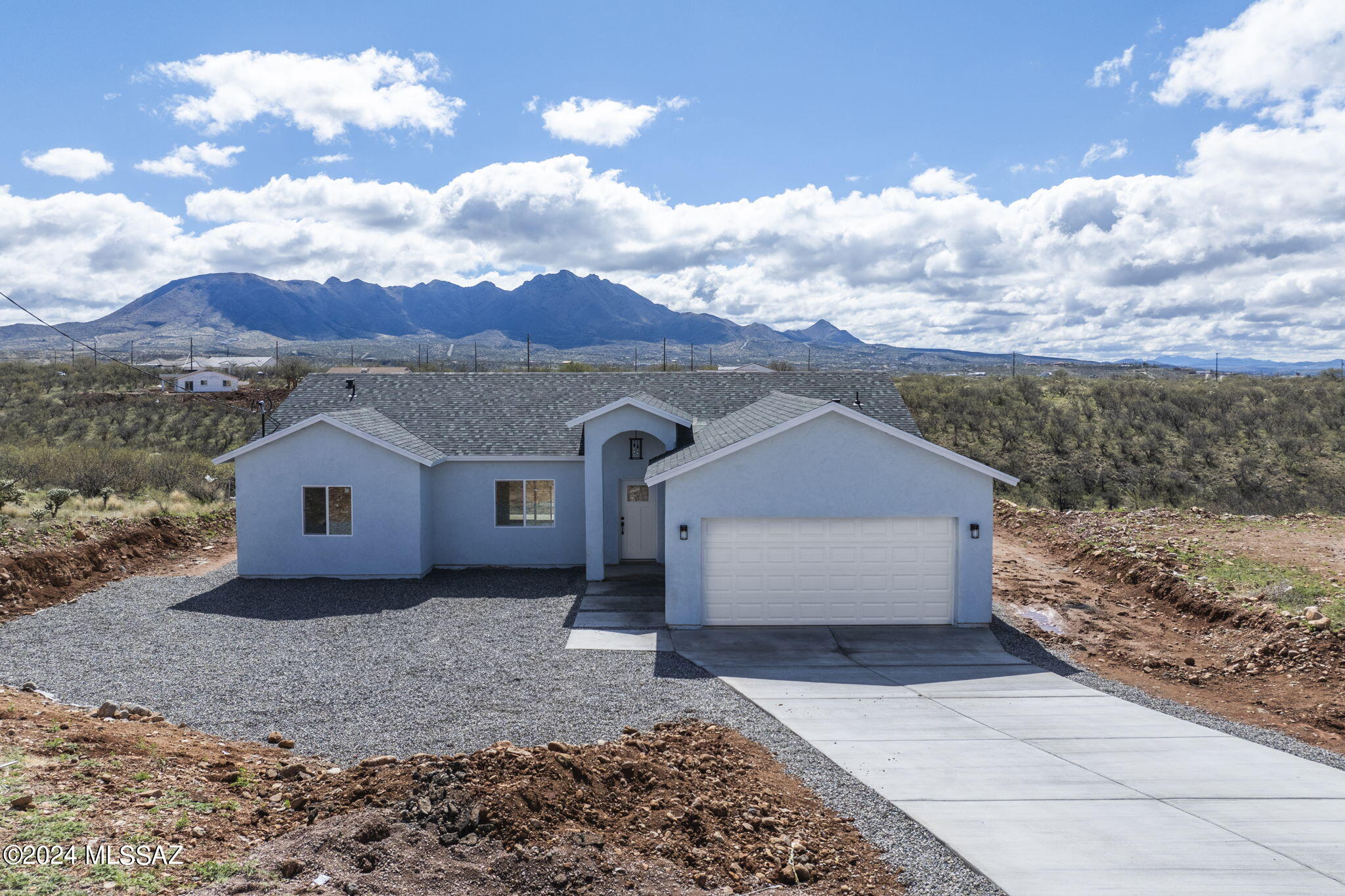 Embrace the breathtaking views of majestic mountains that serve as the backdrop to this exceptional property. Large windows strategically placed throughout
the home allow natural light to illuminate the living spaces while providing uninterrupted views of the surrounding landscape. This brand new, 3-bedroom, 2-bathroom home spans an impressive 1,344 sqft, showcasing meticulous craftsmanship and attention to detail. The floor plan has a great room concept making it open, bright and airy. Step into a private retreat with a covered patio overlooking a naturally landscaped backyard. The outdoor space, spanning a generous 27,256 sqft, provides a tranquil setting for relaxation and al fresco gathering.