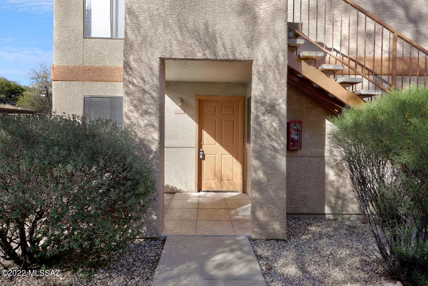 Nestled in the Villas at Sabino Canyon Gated Community, this beautifully maintained Catalina Foothills ground floor condominium features a preferential floor-plan, and is minutes away from some of Northeast Tucson's best schools, shopping, dining, entertainment, and recreation. Large living room with tile floors, Kitchen features cherry cabinets and Stainless Steel appliances. 3 bedrooms, 2 full bathrooms, plus walled & covered patio, this unit is ready for you to make all your own. Carpet in all the bedrooms, ceiling fans and covered assigned parking spaces with community guest parking, too. This property has all the amenities you will love including, pool, spa and fitness center!