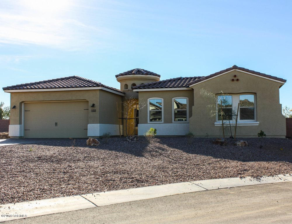 QUICK DELIVERY HOME! Spanish-style Tortolita floorplan with separate teen retreat, or in-law quarters. Enclosed front paver courtyard features beautiful two-way gas FP to the formal DR. Large eat-in kitchen w/upgraded, stacked  cherry spice cabinets, granite counters, stainless steel gourmet appliances, walk-in pantry, breakfast bar and servery opens to the greatroom, which makes this home perfect for entertaining! Master retreat features a walk-in closet and relaxing walk-in shower with spa niche. Other upgrades include: 20x20 porcelain tile, cultured granite in secondary baths, two-tone paint, recessed lighting, plumbing for soft water loop, coffered ceilings, security pre-wire and more!