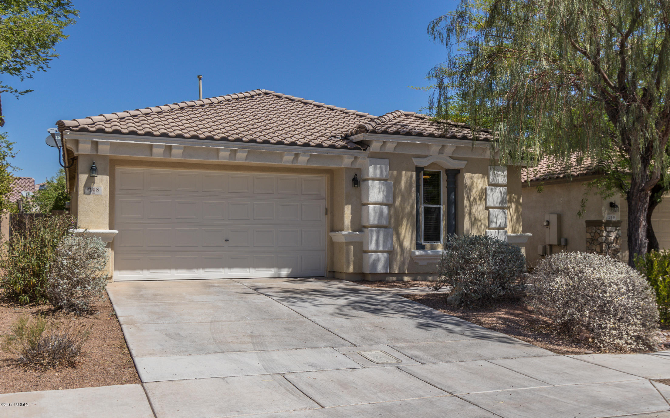Welcome Home! This beautiful, one-story KB Home in Rancho Sahuarita community has 3 bedrooms + den and 2 bathrooms. Special features include extended ceilings, open floor plan, carpet and large tile, ceiling fans in all rooms, Hunter Douglas wood blinds, and multi-room audio system. Master Suite includes walk-in closet and bathroom w/raised height cultured marble vanity, garden tub, and separate shower. Spacious kitchen offers an island, Corian countertops, hickory cabinets w/wine rack, and all black appliances. Low maintenance landscaped backyard boasts a covered patio w/ceiling fan prewiring, native plants w/automated drip irrigation, and stucco fencing. Located within 2 miles of Rancho Sahuarita Marketplace and Sahuarita Town Center. Don't miss this amazing opportunity!