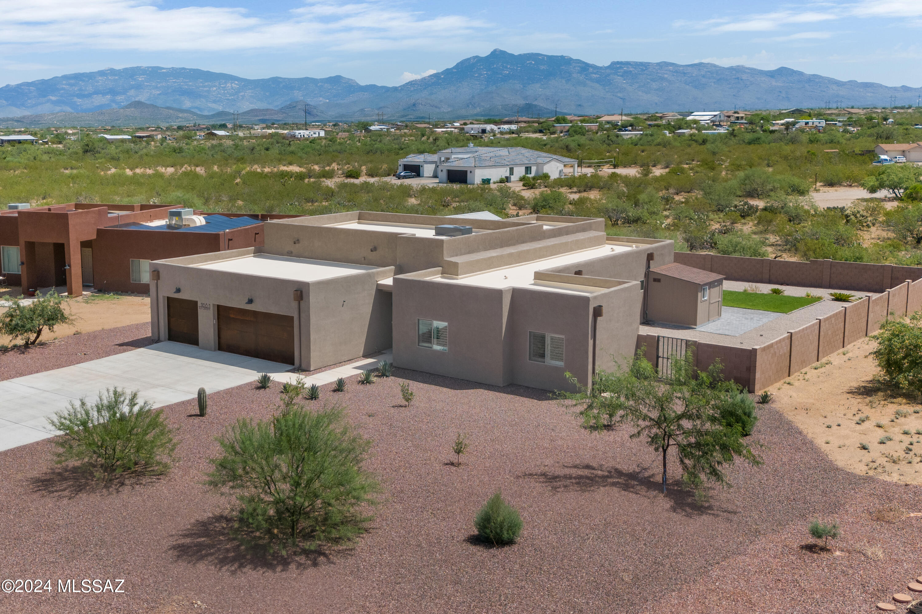 You've found it, that rare home on over an acre with a pool and less than 2 years old! With over $100K in landscaping and salt water pool, you get the benefit without the work! Even better, no HOA so you can park your RV, trailer, etc and live in the award winning Vail School District. Step outside to your extended tiled patio and relax in your soaking lagoon before your swim. With a large enclosed block wall, you still have room to add more fun and games so there's something for everyone. With additional untouched desert behind the wall, you have Rincon Mountain views too. Inside, enjoy all tile throughout, modern finishes, spacious gourmet kitchen with double oven and plenty of cabinet & counter space. And top it all off with 1G Fiber Optic internet! Welcome to high tech country living!