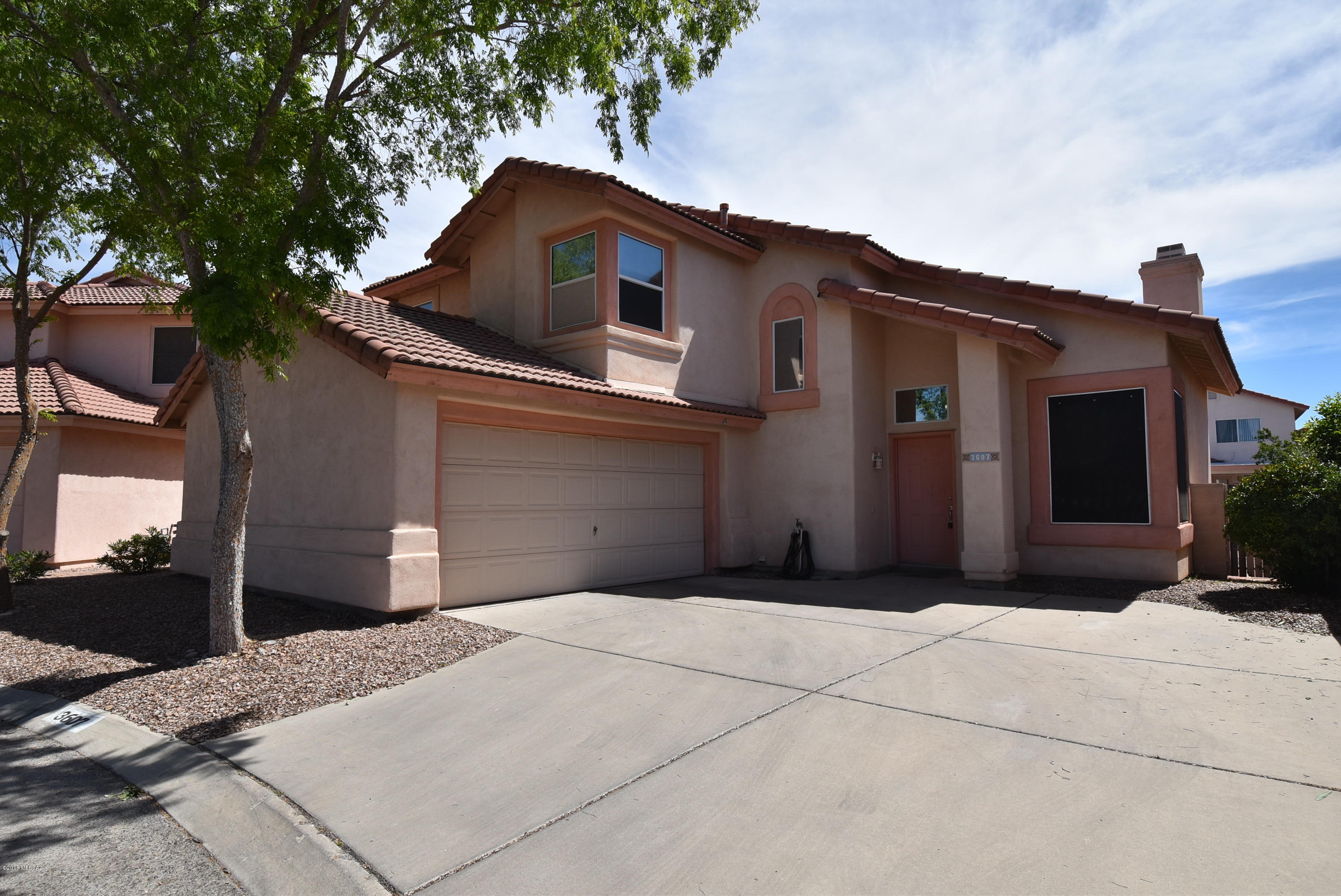 Beautiful home in North Ranch!  2 community pools, Marana Schools nearby and close to I-10 freeway! 3 bedroom, 2.5 bath, high vaulted ceilings in living room plus a fireplace. Stainless kitchen appliances including a french door refrigerator.  Master suite includes a walk in closet and dual sink vanity.  Washer and dryer included.  2 car garage. Back yard backs to open area with no houses directly behind. 1 year minimum lease. Non-smoking home. Renters insurance required. Subject to application process & credit approval. Call listing agent for additional leasing information.