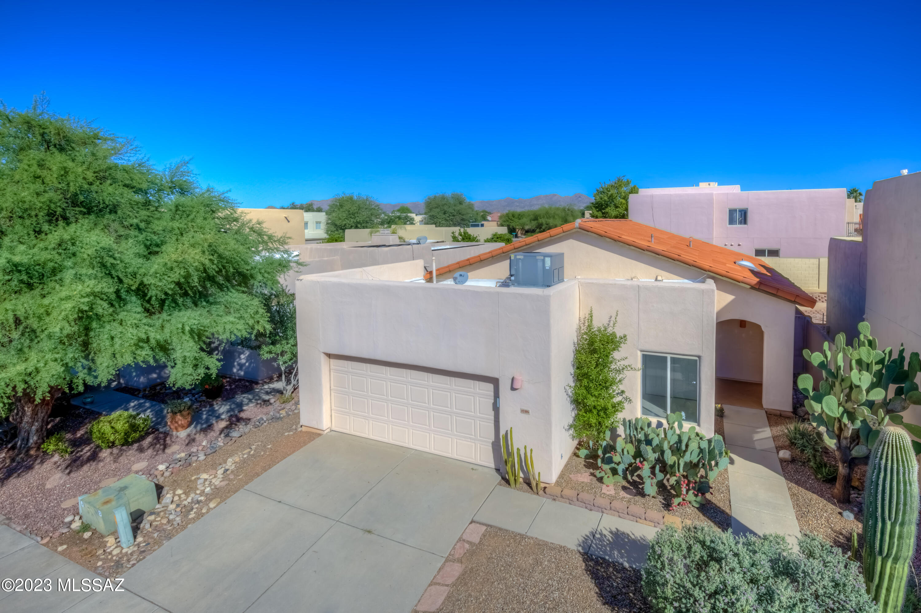 Welcome to this lovely & well-maintained home in the heart of Copper Creek! Featuring 1,465 sq.ft., 3 beds, 2 baths, a bright & open Great Room/Kitchen and serene rear patio, this home is sure to exceed your expectations! The Kitchen features granite countertops and stainless steel appliances including refrigerator. Newer interior paint, updated door hardware and soaring ceilings in the Great Room add to the modern tone! The spacious Primary Bedroom features an en suite bath with dual vanity, shower and walk in closet. Venture out back to the private rear yard with covered patio, raised seating area w/mountain views and mature landscape. New exterior paint & poly pipes replaced April 2023! Close to shopping, dining, schools, medical and recreations, the location is unbeatable! A MUST SEE!