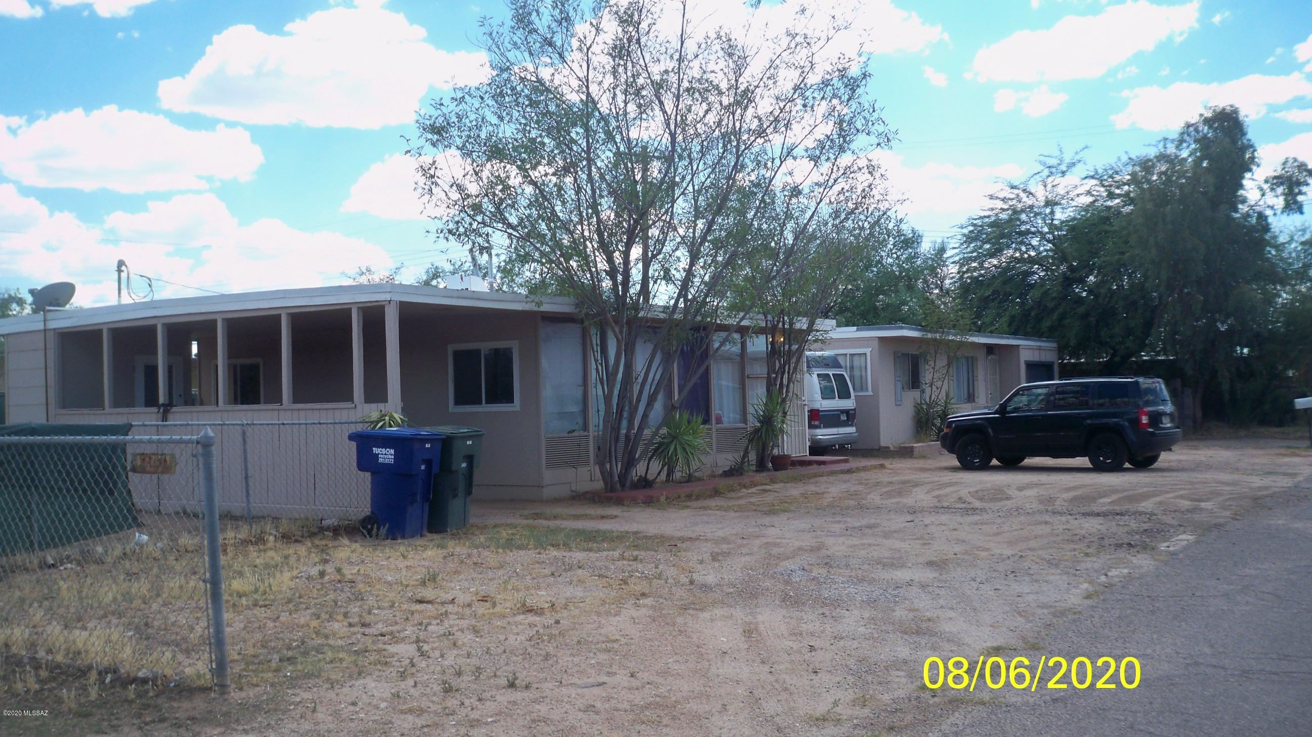 Two nice separate 2BR/1BA single family homes on a quarter acre lot!  No. 2 can use some TLC!   Both homes have large yards, one has a carport and one has a one large one car garage.  In addition, all separate utilities, tenants pay own electric, gas, water/sewer/trash.  Quiet small street, no traffic.  Ideal for investors!