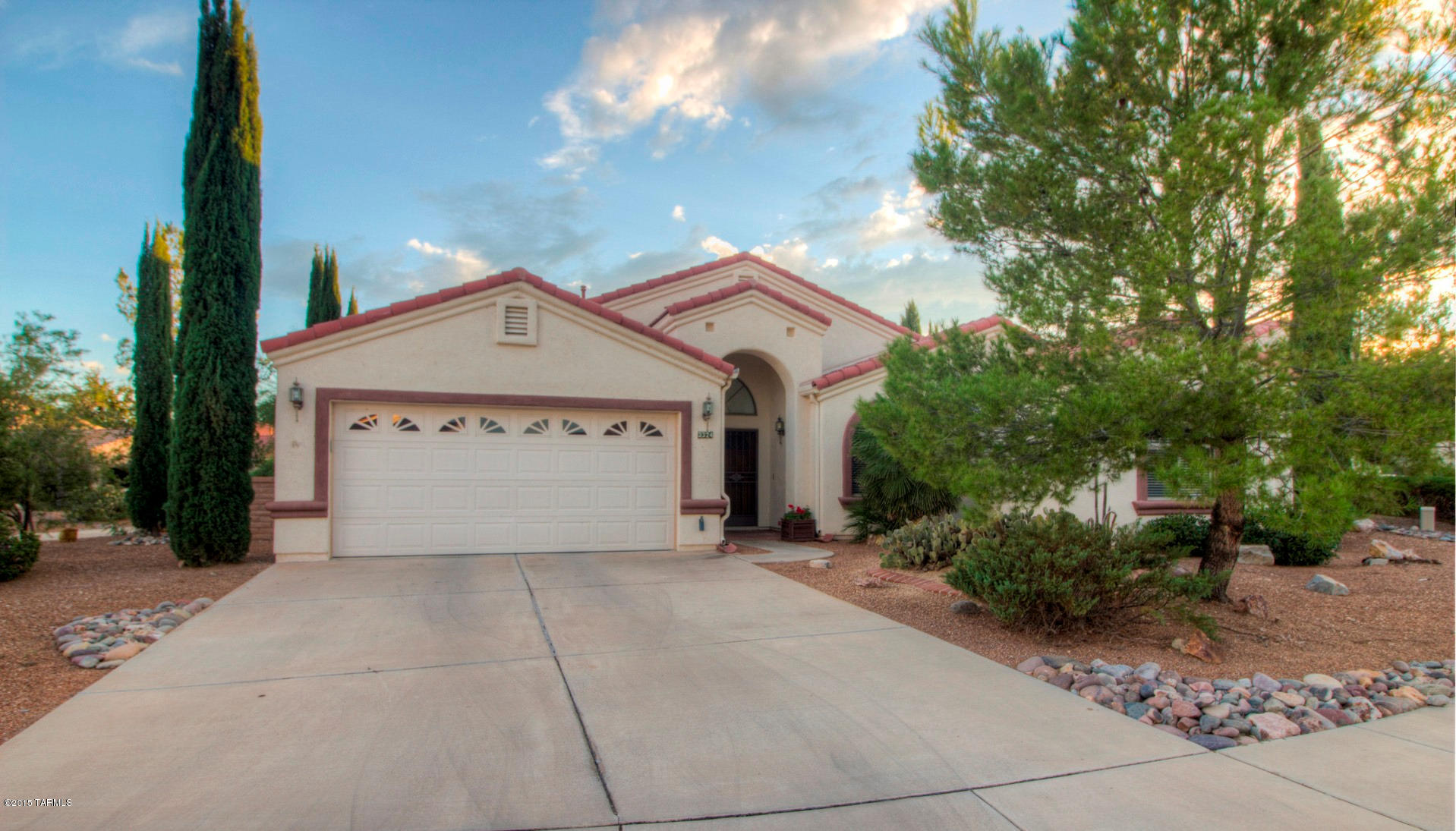 With just a bit of imagination and TLC this will be a real desert beauty! Great opportunity is right before your eyes - nestled quaintly on a corner lot this home has great curb appeal with its multi-level roof lines, arched windows and mature trees. You’ll enter through solid wood double doors into a huge great room floor plan with vaulted ceilings, open dining area and a corner fireplace next to the large picture window overlooking the back yard. The kitchen has bountiful lots of cabinets, loads of counter space, a gas range, serving bar plus an eat-in nook area with views with walk-out patio access. Lush desert vegetation makes your own botanical garden surroundings. A large covered patio with roll-down sunshades is sure to create a favorite spot for outdoor entertaining & dining.