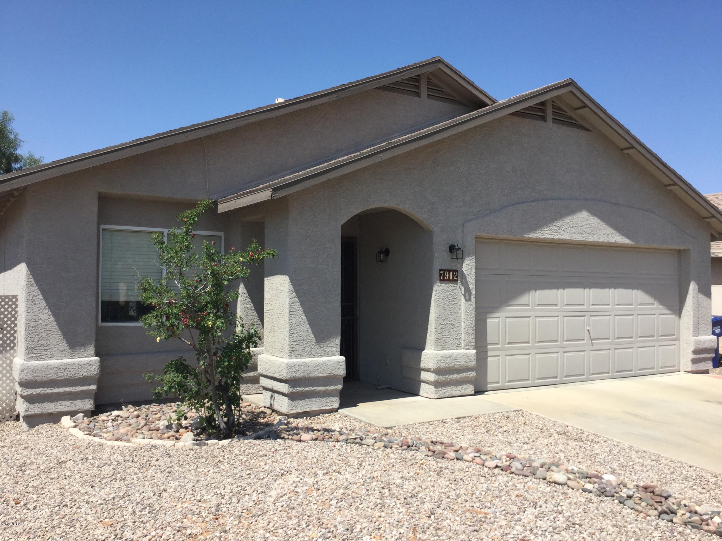 Here is your chance to live in popular Rita Ranch without an HOA.  This 3 bedroom home has several updates and upgrades throughout.   The home features a dining/great room plus a separate family room area off the kitchen which includes a fireplace. A spacious master suite, covered rear patio with extended paver patio, grass play area in rear yard, separate laundry room with storage,  updated kitchen decor and a pantry,  Two car garage, plus much more.  Leased solar system is already installed
