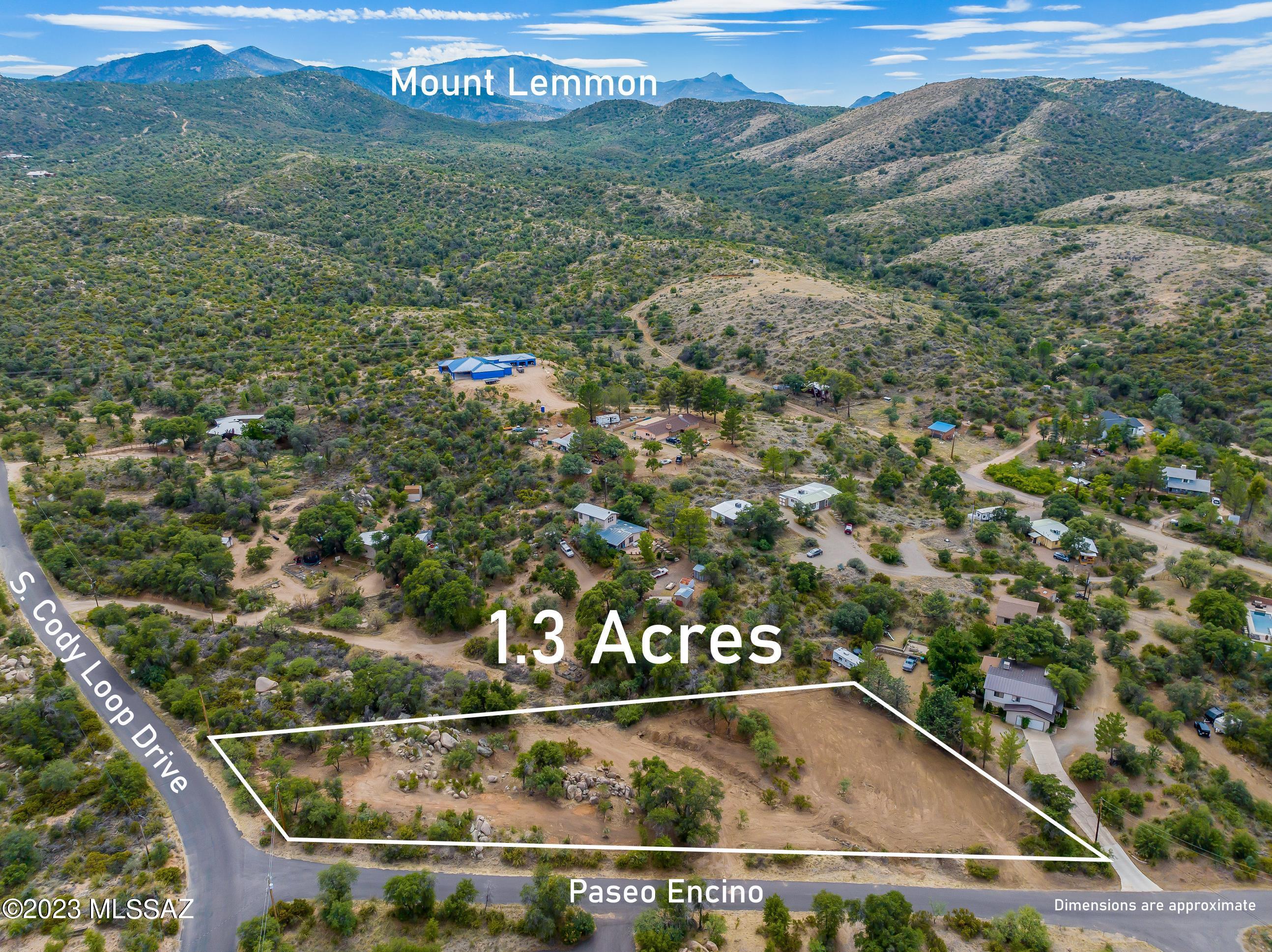 Fantastic 1.3 AC horse property located on the corner of Cody Loop road in the beautiful town of Oracle. You'll love the large, mature oak trees, manzanita & boulders that adorn this lot. Owners have cleared the land and spots are ready to envision your new dream home! Perc test & blue prints are available and corners are marked! Small town charm awaits! Come enjoy the cooler  temperatures, hundreds of miles of hiking trails, local shopping & much more. Utilities are available, septic system will need to be installed. Located on a paved road and NO HOA! What are you waiting for? Come walk the property & find the adventure you seek! Welcome Home