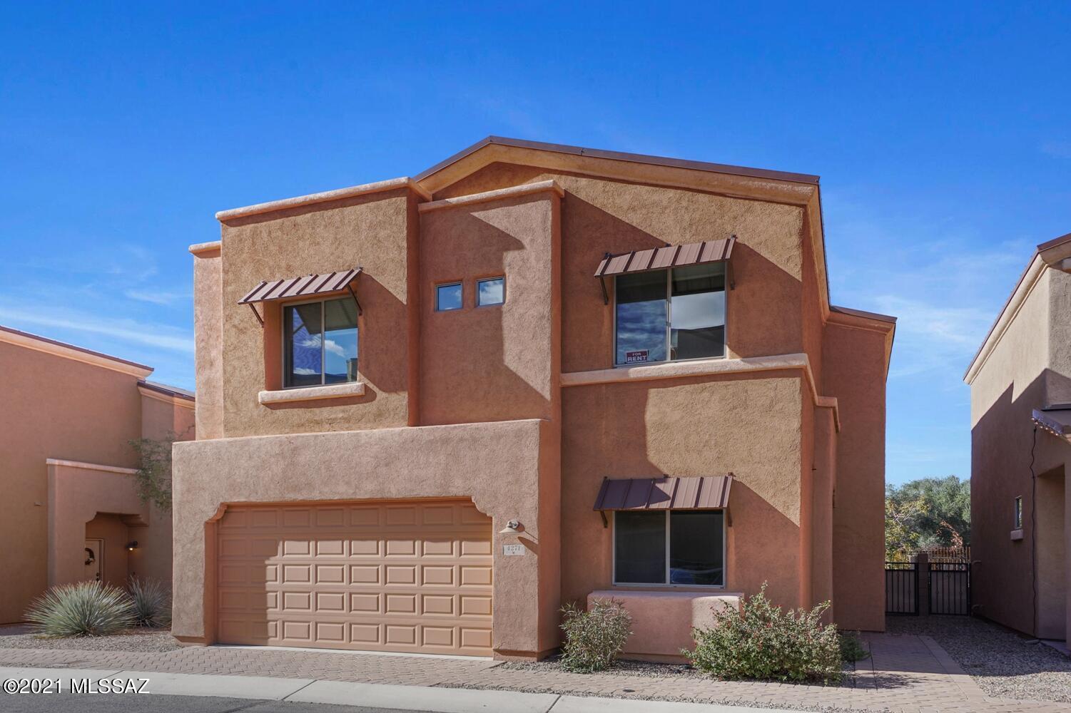 Beautiful 2-Story, AF Sterling Home located in highly desirable Riverwalk/Loop Path. This gated community offers a fitness center, walking/biking distance to Riverwalk, pool/spa/club house, convenient shopping, dining & entertainment. Large Great room, perfect for entertaining or just relaxing. Office/Den and half bath on first floor. Kitchen with granite counter tops, brand new stainless steel appliances, porcelain tile downstairs and bathrooms, two car garage with epoxy coating. Upstairs, all bedrooms and laundry room with W/D. Huge Master Suite w/large walk in closet, separate shower/tub, and double sink vanity. Enjoy the cozy, private backyard with artificial turf and covered patio. TUSD Schools, No cats please.