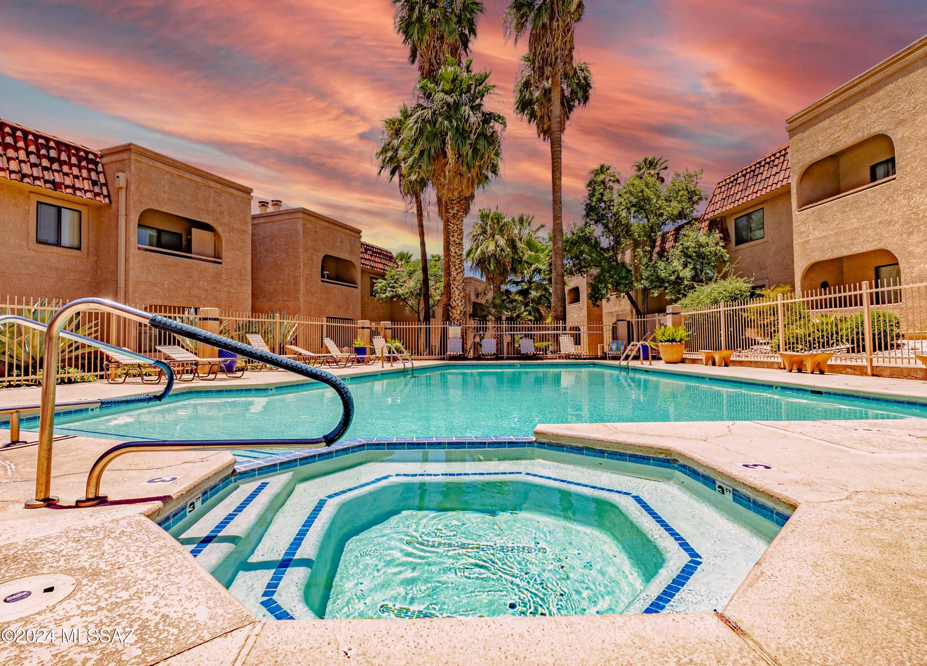 LOCATION! LOCATION! LOCATION! 
 Foothills living at an affordable price!  Restaurants, shopping, upscale mall, clinics, golf, spas, museums, hiking, and VIEWS all at your front doorstep, for a FRACTION of the average Foothills real estate price! 
 This updated first floor unit in the popular Skyline Springs Condo Community allows for a cozy and comfortable feel with resort-style living.  Enjoy your community's heated pool, hot tub, clubhouse, and beautifully maintained grounds with lighted walking paths.  HOA fee includes water, sewer, garbage collection, fire protection, termite warranty, AND roof and exterior building maintenance.  And don't forget...this is the Catalina Foothills School District!  Welcome HOME!