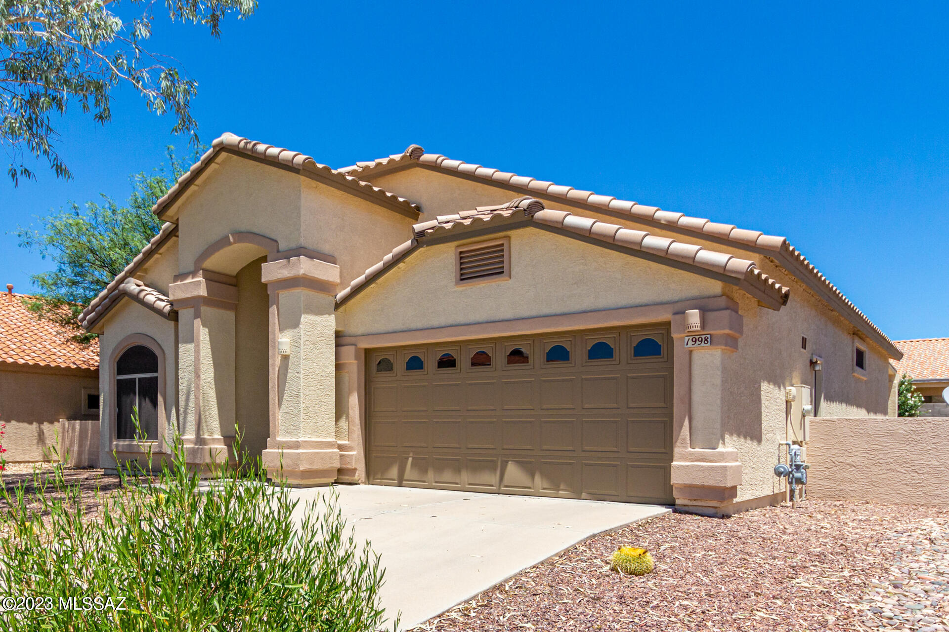 Experience the charms of Oro Valley in this turnkey La Cholla Estates home. Located in the Amphitheater school district, this well-maintained home is freshly painted in neutral tones and offers a split bedroom floor plan with three carpeted bedrooms. The well-appointed kitchen features newer Samsung and LG appliances, pantry, and sun-drenched breakfast nook. High ceilings and ample natural light in the dining area and great room create a warm and inviting ambiance. The spacious master suite offers ample storage with his-and-her closets. Other highlights include a 2022 HVAC system, two-car garage with side yard access, and tile and laminate flooring in the living areas. The large backyard features mature oleanders, young fig trees, an extended patio, and potential for your dream pool.
