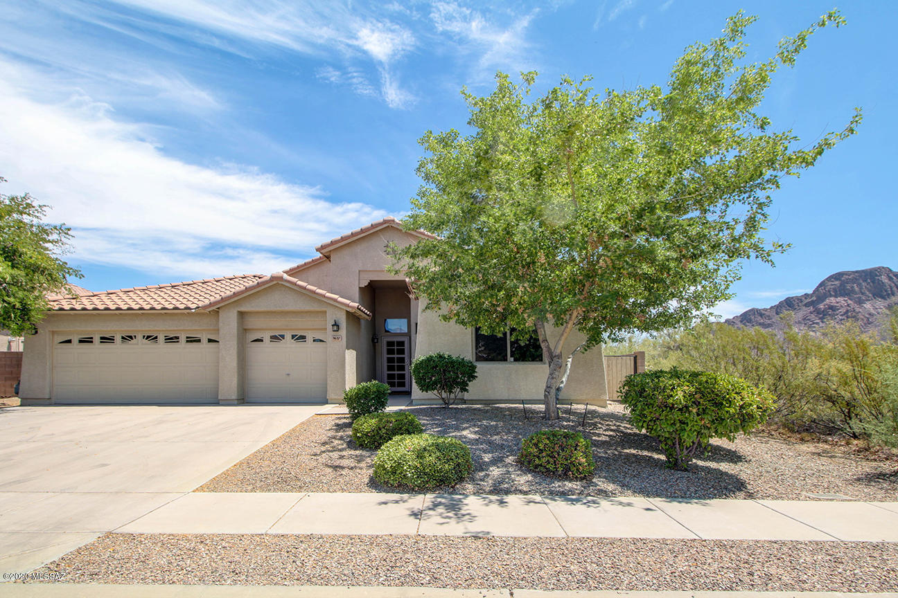 Move-In-Ready! Incredible 4 bedroom, 2 bathroom home available in desirable Tucson Mountain Sanctuary. Well placed on a large cul-de-sac lot with breathtaking mountain views. Impressive interior boasts an elegant formal living and dining area as well as a spacious separate family room. Gorgeous flooring and soft plush carpet. Open concept kitchen features white appliances, gas stove and extended island.  Large windows throughout allow for ample natural lighting and beautiful mountain views. Master retreat includes a huge walk-in closet and a private bathroom with a walk-in shower. You will love the backyard. With no neighbors to the rear and it is very secluded and offers sweeping mountain views. Come take a look!