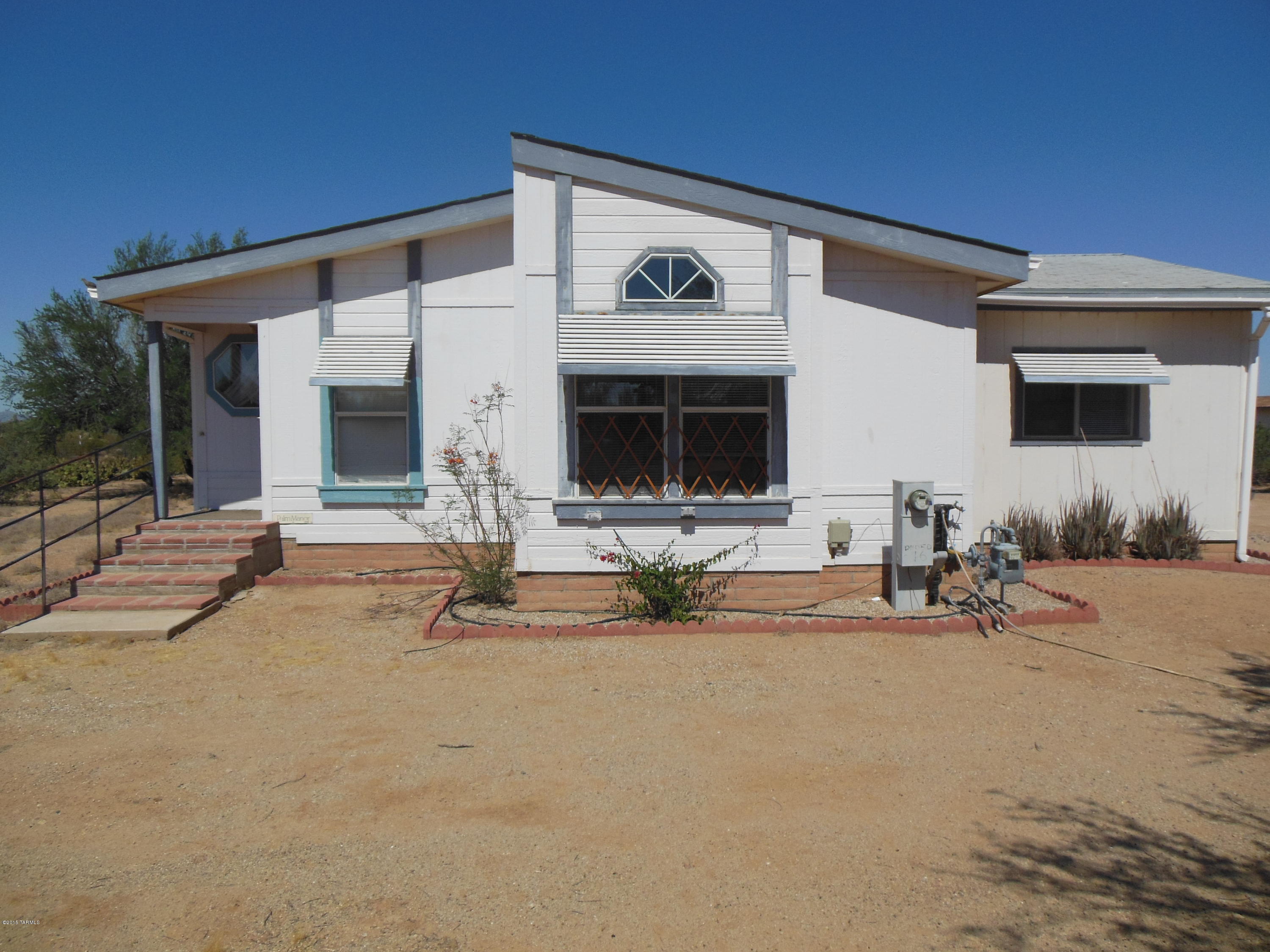 Nice well kept home on one acre horse property.  Shows clean, plenty of room to park your RV or boat. Land behind property is Federal Lands,  You have great mountain views and beautiful sunsets.  Fenced in yard, Garage with Workshop for the handy person in your family. The average water bill is only $35.00, the average gas bill in summer is only $16.00  and around $70.00 in Winter since it is natural gas.  Some of the furniture in home is available on separate BOS outside of escrow.