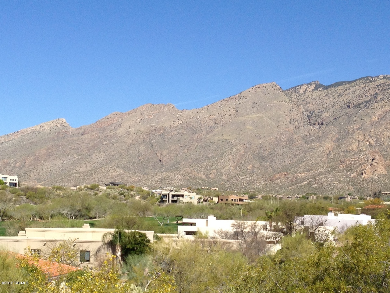 One of the few remaining, un-built lots in prestigious Ventana Canyon. Enjoy valley and mountain views from this gently sloped, elevated pad. Combine with adjacent lot to the south for a fabulous acre plus home site. Minimum allowable home size is 2500 sq ft. Enjoy the wonderful amenities of this gated, golf course community at the base of the Catalina Foothills.