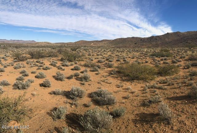 13 acres ready to build and zoned for residential use.  Mountain, desert, city and sunset views from this property.  Located at a nice elevation between 4,400 to 4,600 feet making summers nice and cool.
