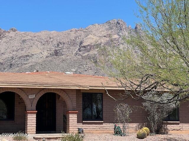 Come see this lovely house that boasts views of Finger Rock from the spacious back yard. This 3 bedrooms, two bath, 1953 sq ft is located in the very desirable Foothills Clusters neighborhood. Saltillo tile throughout the house, updated kitchen with S/S, lots of cabinet space.The oversized primary bedroom has a separate sitting area, walk in closet, large bathroom.The third bedroom can easily serve as a den. Enjoy the covered patio, large backyard with mature trees and pool. Easy walking and cycling throughout the neighborhood, close to mountain trails, shopping, restaurants, School District 16.