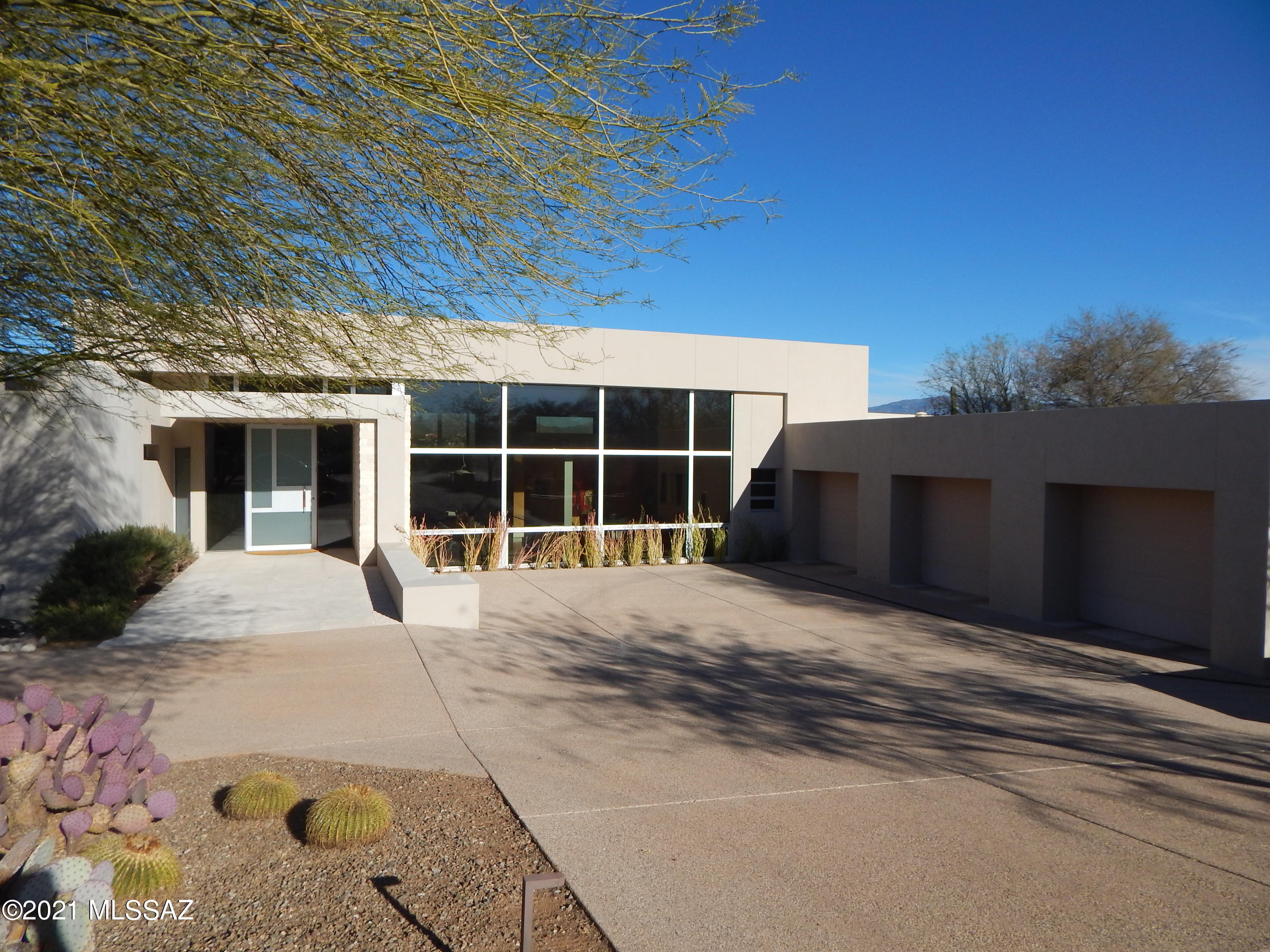 Custom contemporary home located in the world renowned Canyon Ranch Wellness Resort located in Tucson, Arizona.  Designed and built by highly respected architect/builder, John Campisano.  Precision detailing throughout this signature custom build. Portuguese limestone floors with fluid transition from the interior to exterior.
Remote start aluminum clad fireplaces in living room, family room, and master bedroom. Remote controlled blinds, custom kitchen cabinets with European appliances Breathtaking Catalina Mountain views from living room and family room with sliding wall of doors.  
So many incredible details to see...come experience this masterpiece.