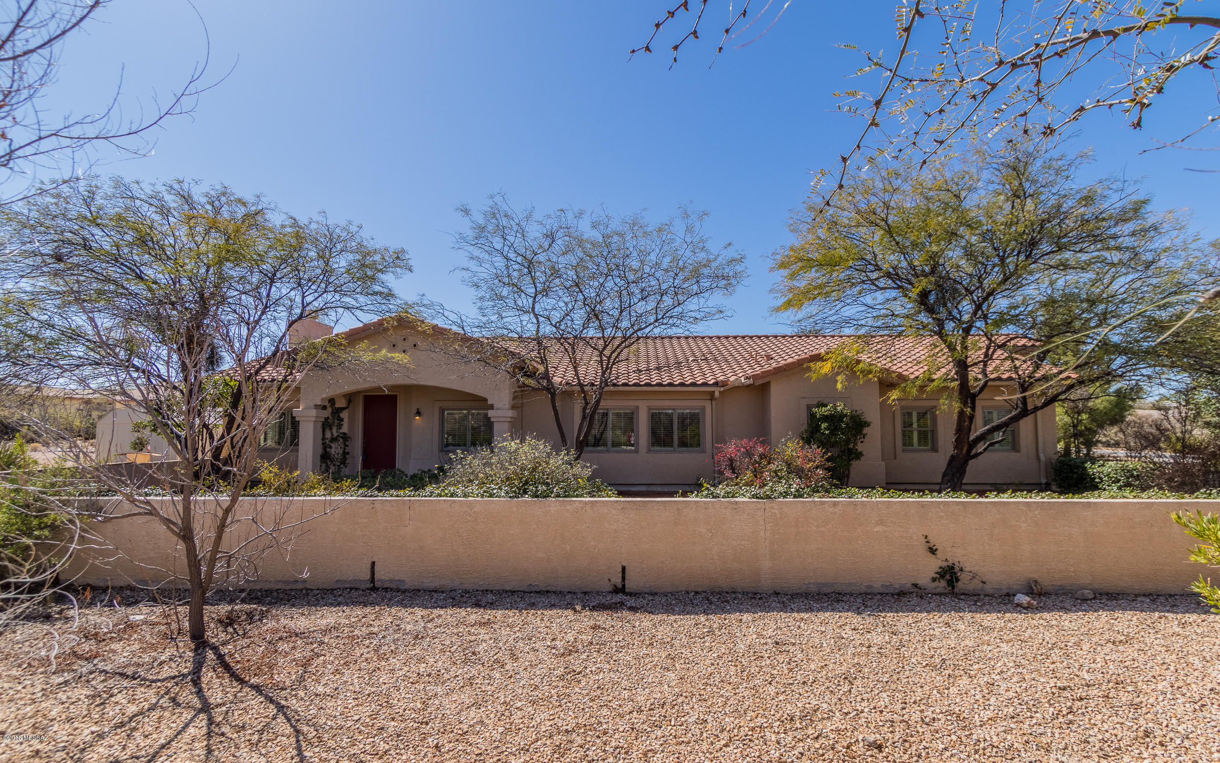 Sleek and contemporary 4BR 3BA home on over an acre in the acclaimed Vail School District.  Bright and spacious second bedroom boasts an ensuite bath.  Very private yard with pool.  Updated kitchen with exquisite granite slab.   The entire patio has been tiled and screened to enjoy indoor/outdoor Arizona living all year round. No HOA.  Welcome Home!