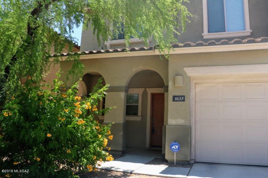 Wonderful two-story home in newer northside subdivision, with 3 bedrooms, 2.5 baths, a 2-car garage.  Paseo del Rio features two inviting parks, and is just a stone's throw to the River Loop!  Better hurry!  This home features stainless steel appliances and lots of cabinets and storage, granite countertops, neutral colors.   You'll love the open floorplan and shady patio for outdoor BBQ'ing in Tucson's beautiful weather!   Upstairs is carpeted, with a spacious  master, two generous guest or child bedrooms, and a large den or office... could make that into a fourth bedroom with just a few minor adjustments!   Backyard is walled, with decorative rock.  This home is waiting for you, but may not last long!  This is a very desirable and pristine  subdivision.  The HOA keeps it looking gorgeous